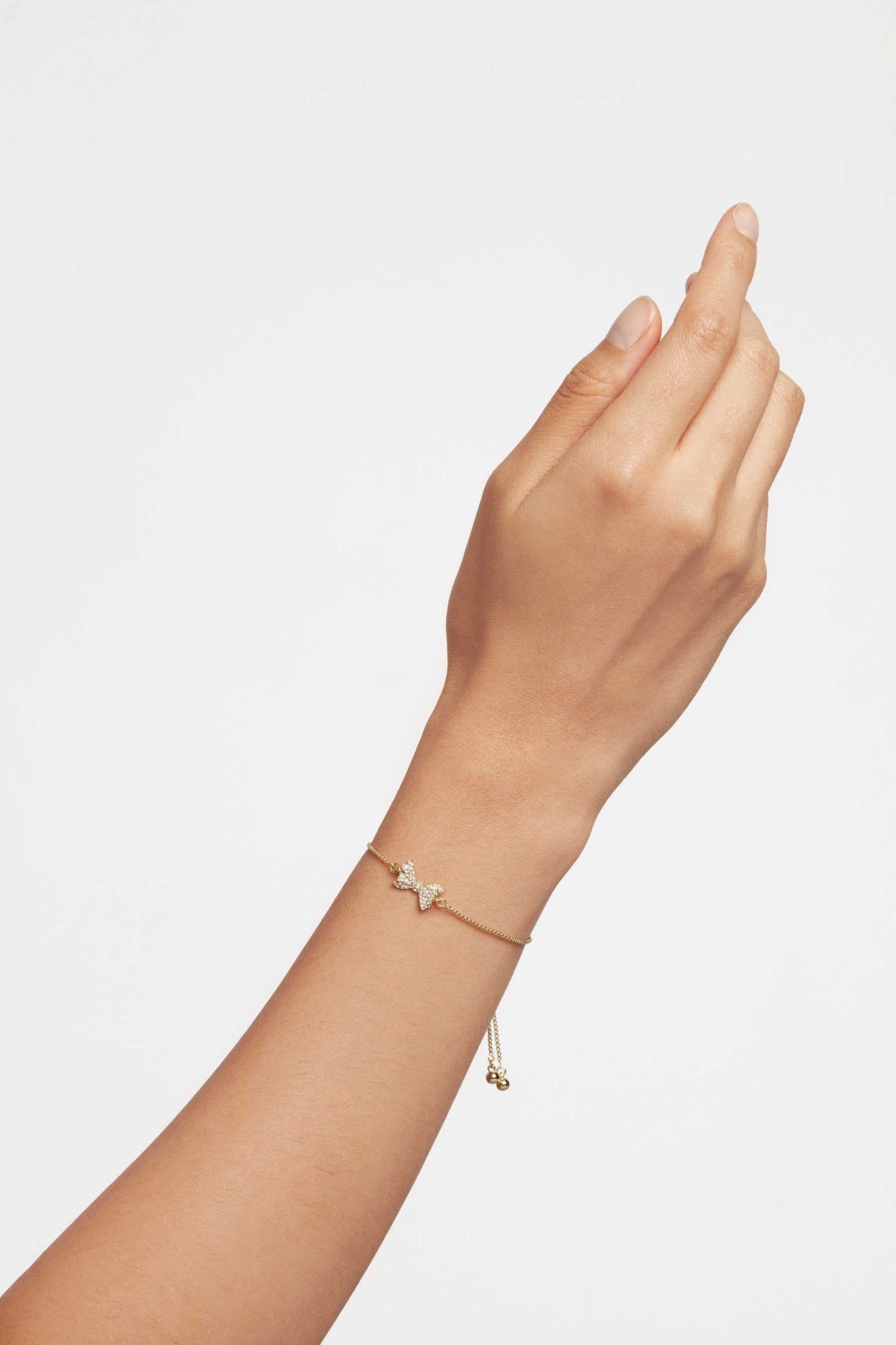 Buy Ted Baker Gold Tone BARSET Crystal Bow Adjustable Bracelet from Next Luxembourg