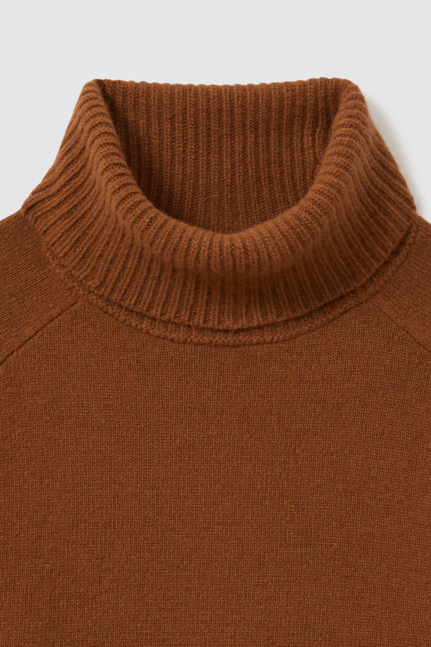Woolen roll neck jumper on sale