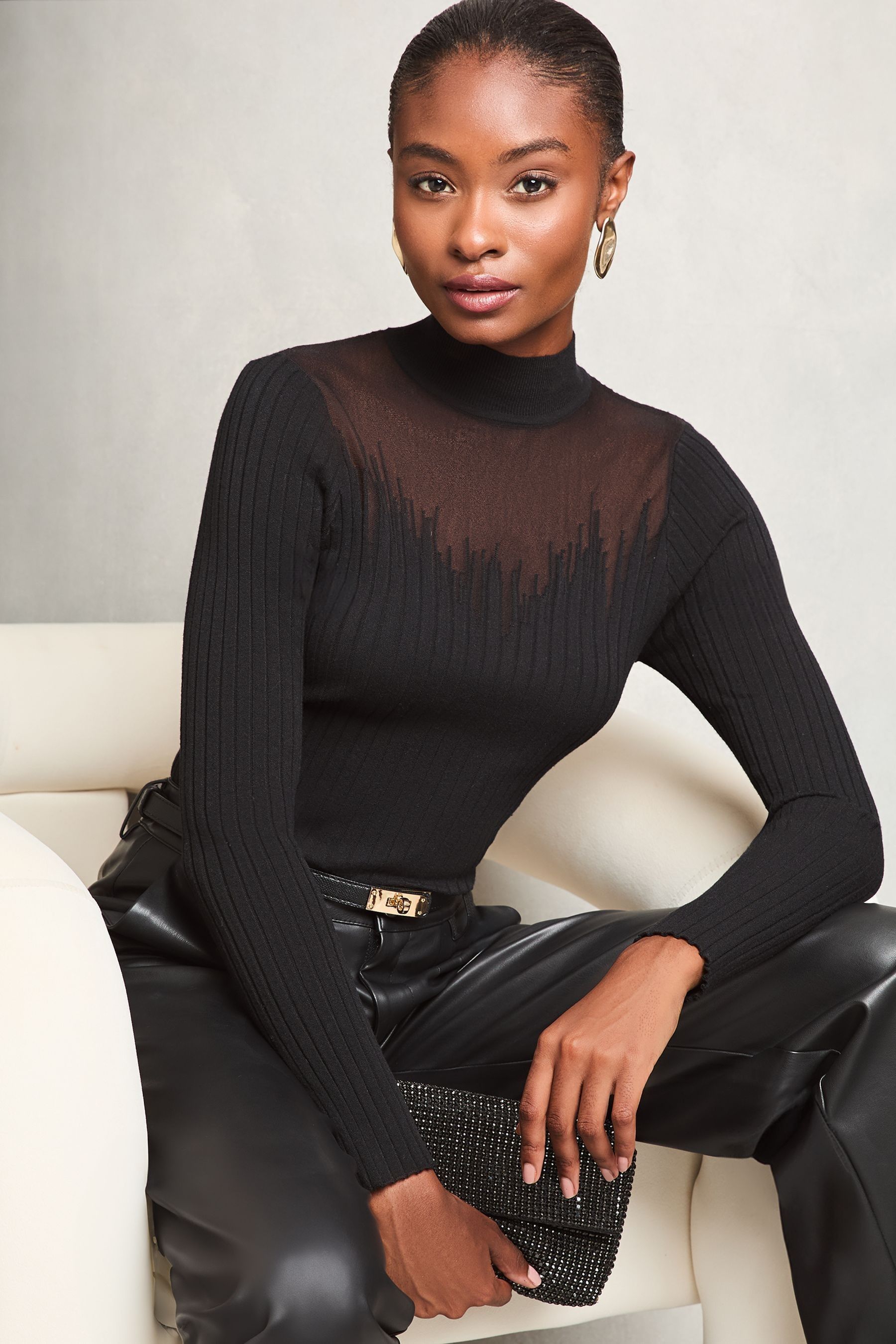 Black jumper with sheer sleeves 2025