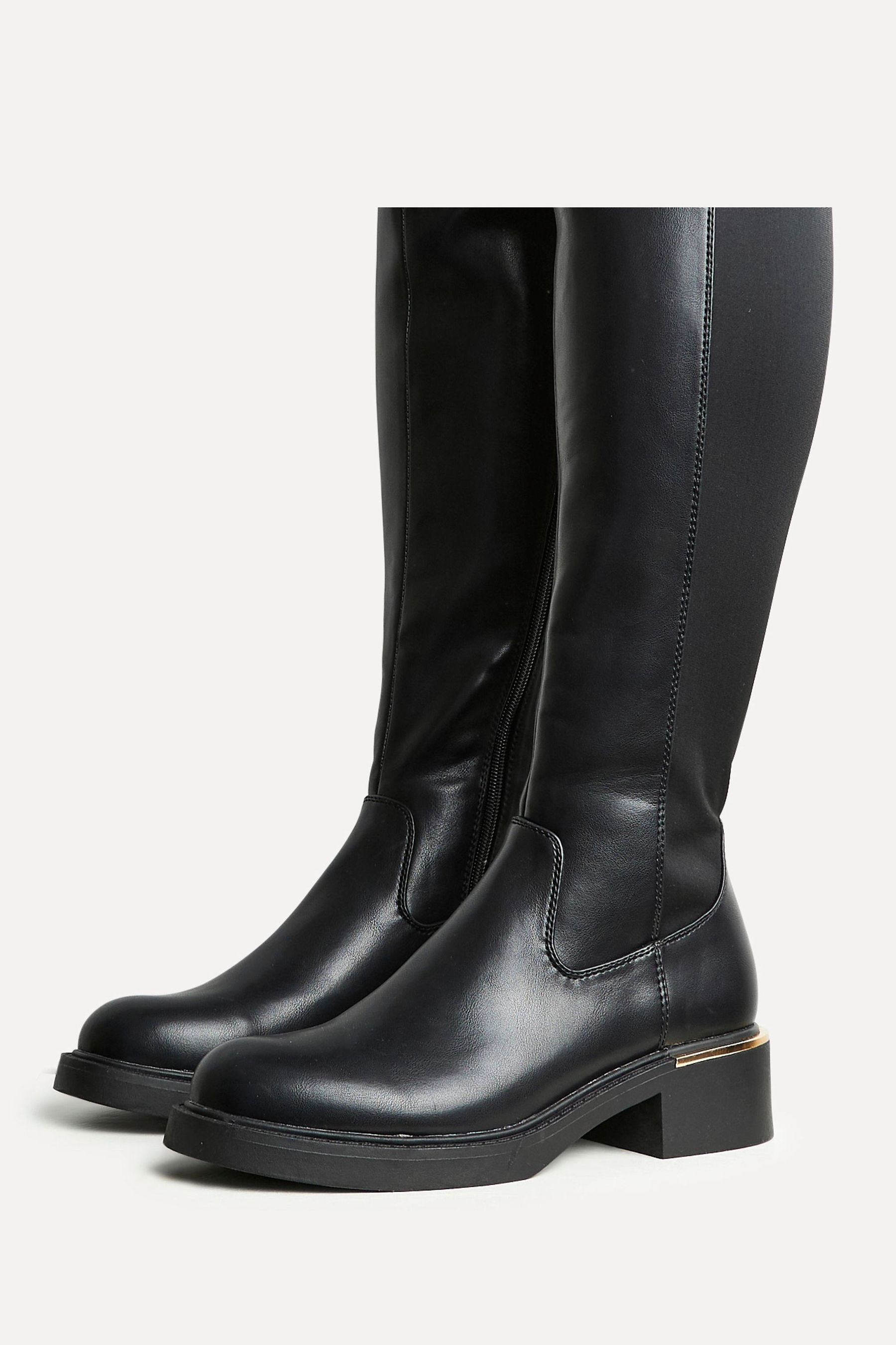 Knee high boots with gold trim top