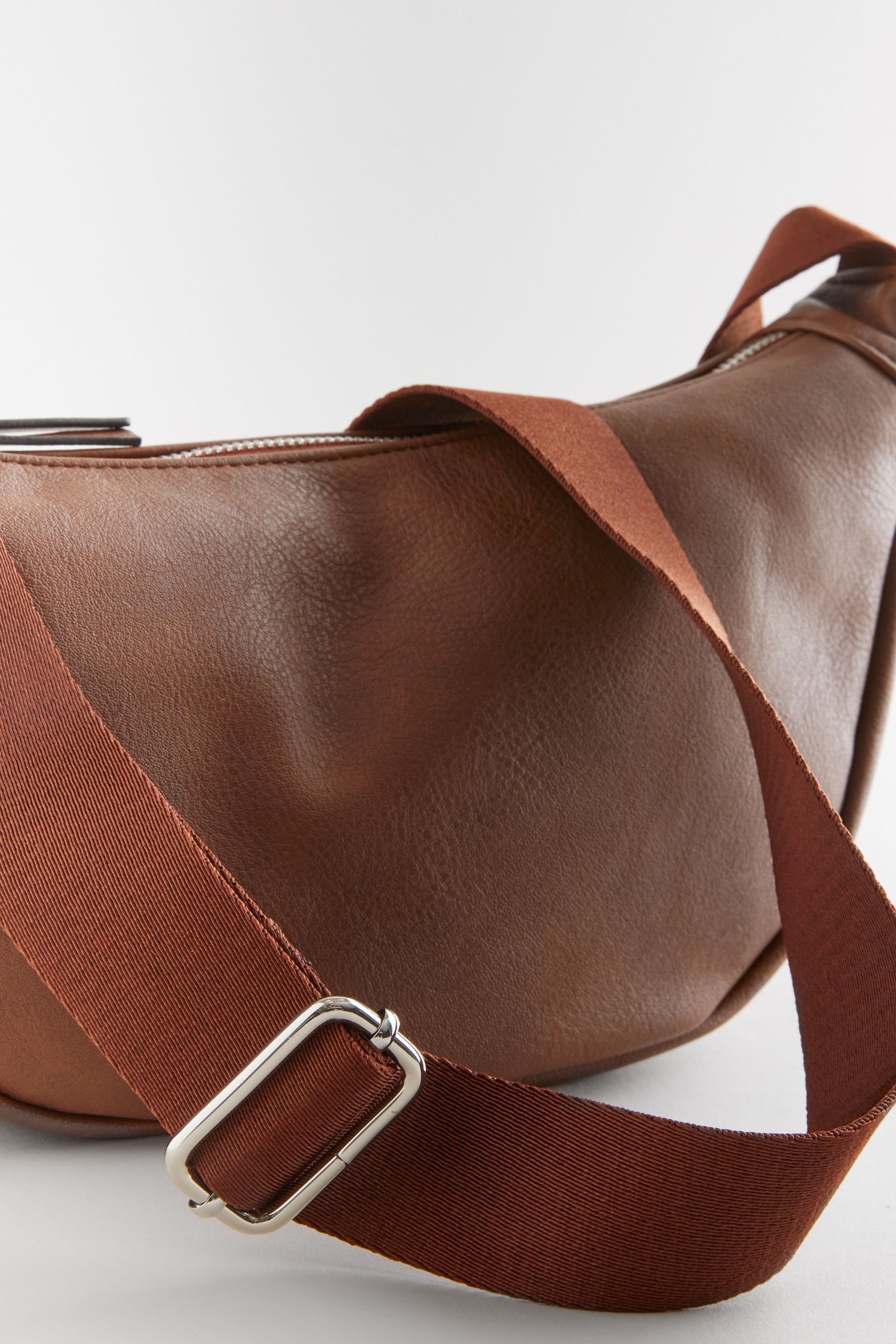 Tan sling bags store