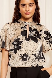 Friends Like These Floral Black/White Petite Printed Flutter Sleeve Keyhole Blouse - Image 1 of 4