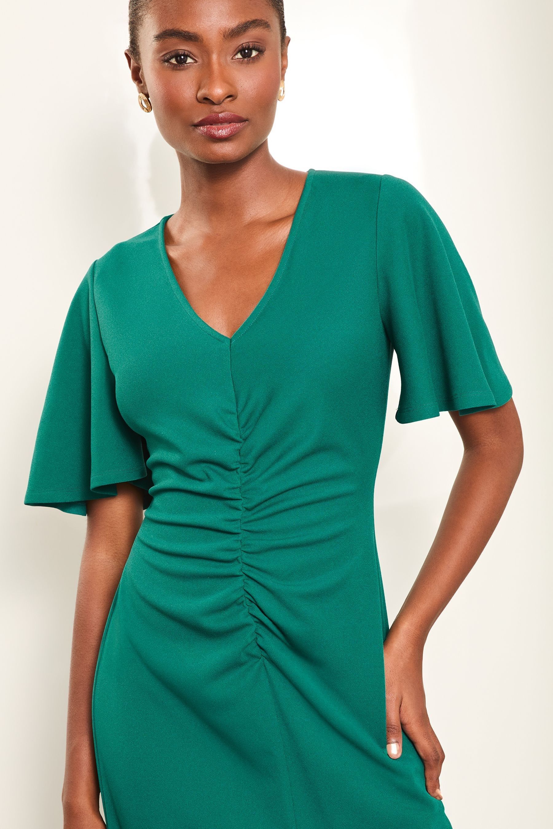 Buy Lipsy Green Short Sleeve V Neck Ruched Fit And Flare Midi Dress from Next Luxembourg