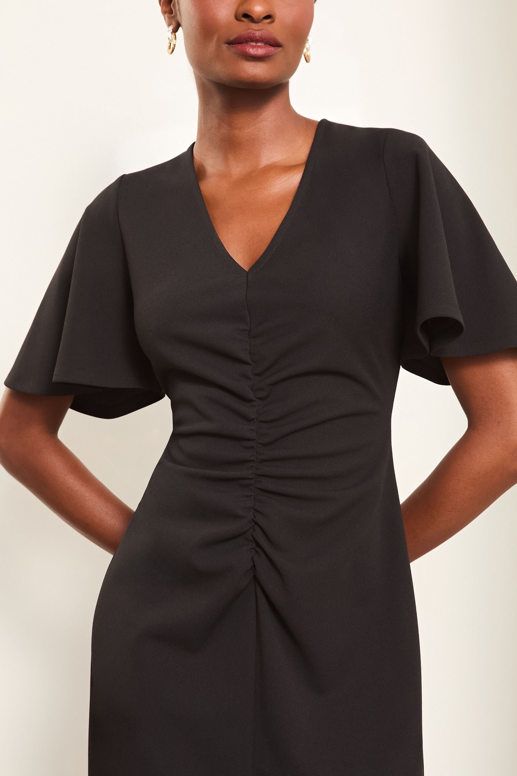 Buy Lipsy Black Short Sleeve V Neck Ruched Fit And Flare Midi Dress from Next Canada
