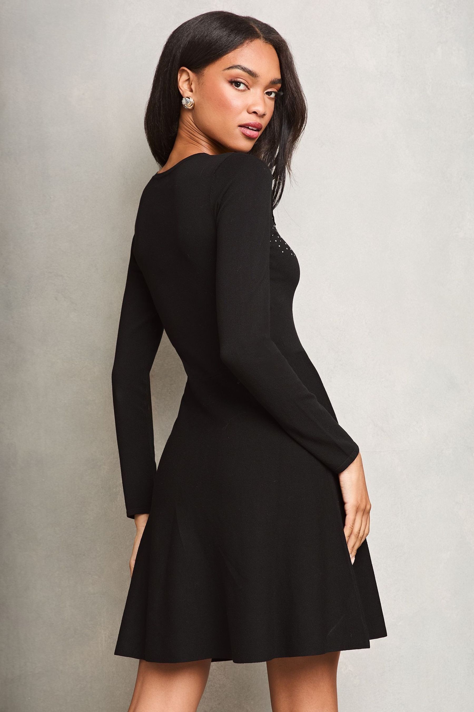Buy Lipsy Black Petite Velvet Floral Applique Knitted Dress from Next United Arab Emirates