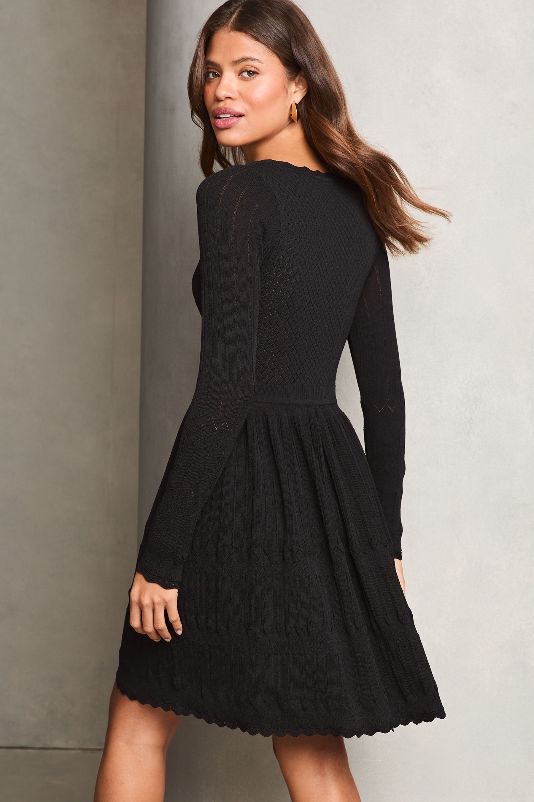 Buy Lipsy Black Petite Long Sleeve Stitch Detail Lantern Knitted Dress from Next United Arab Emirates