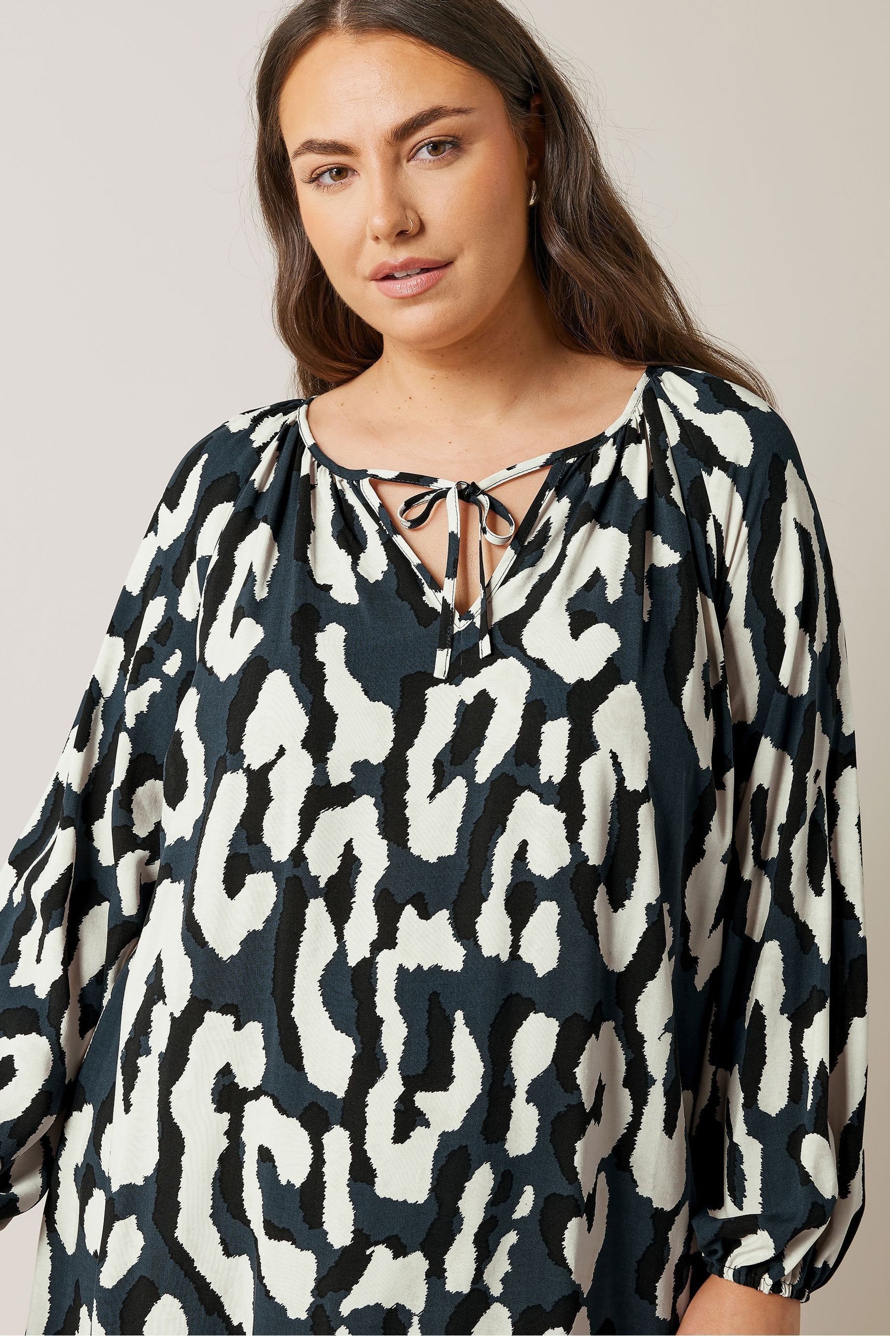 Buy Evans Abstract Animal Print Mini Dress from Next Qatar
