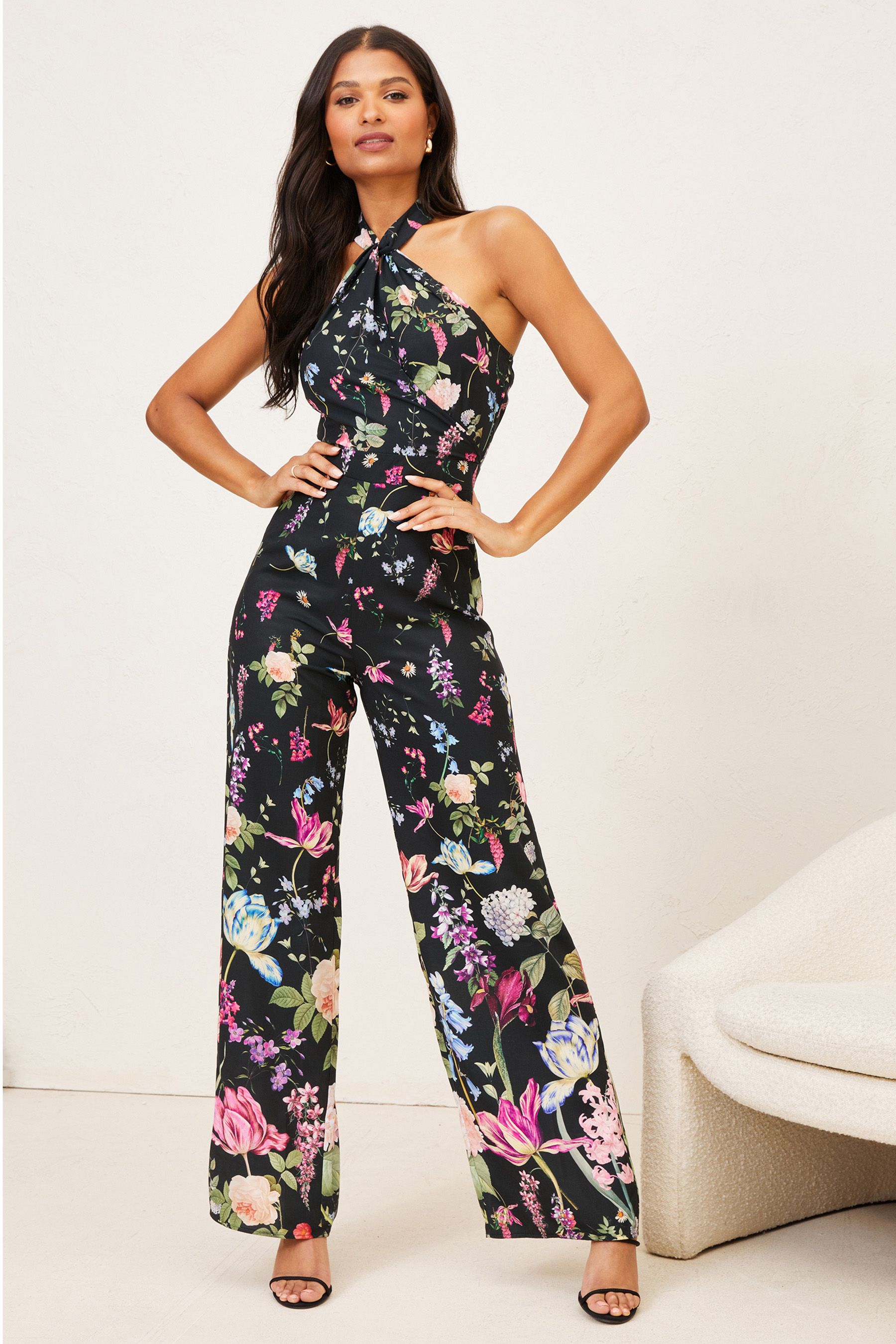 Buy Lipsy Floral Petite Twist Halterneck Jumpsuit from Next Luxembourg