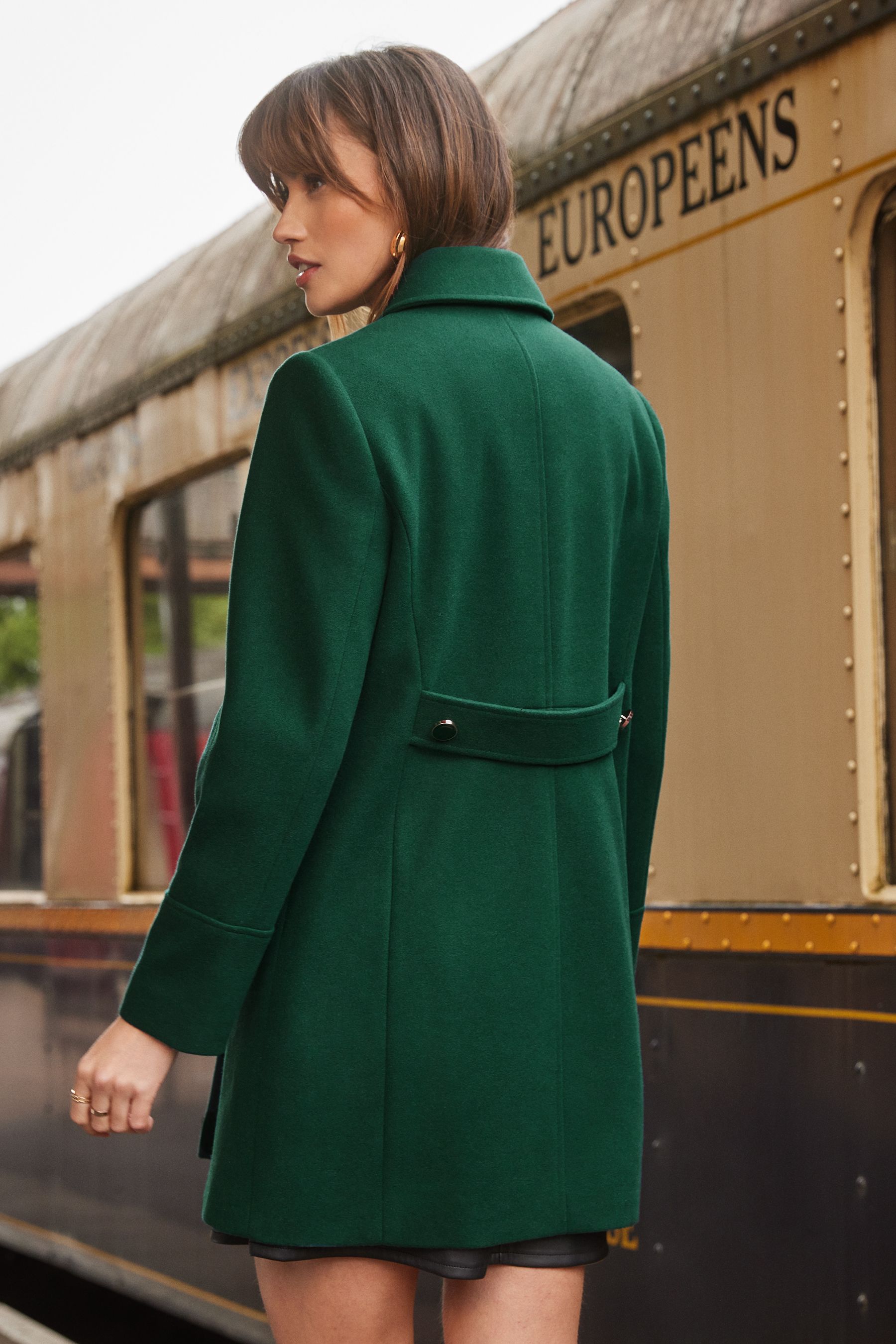 Green dolly coat store