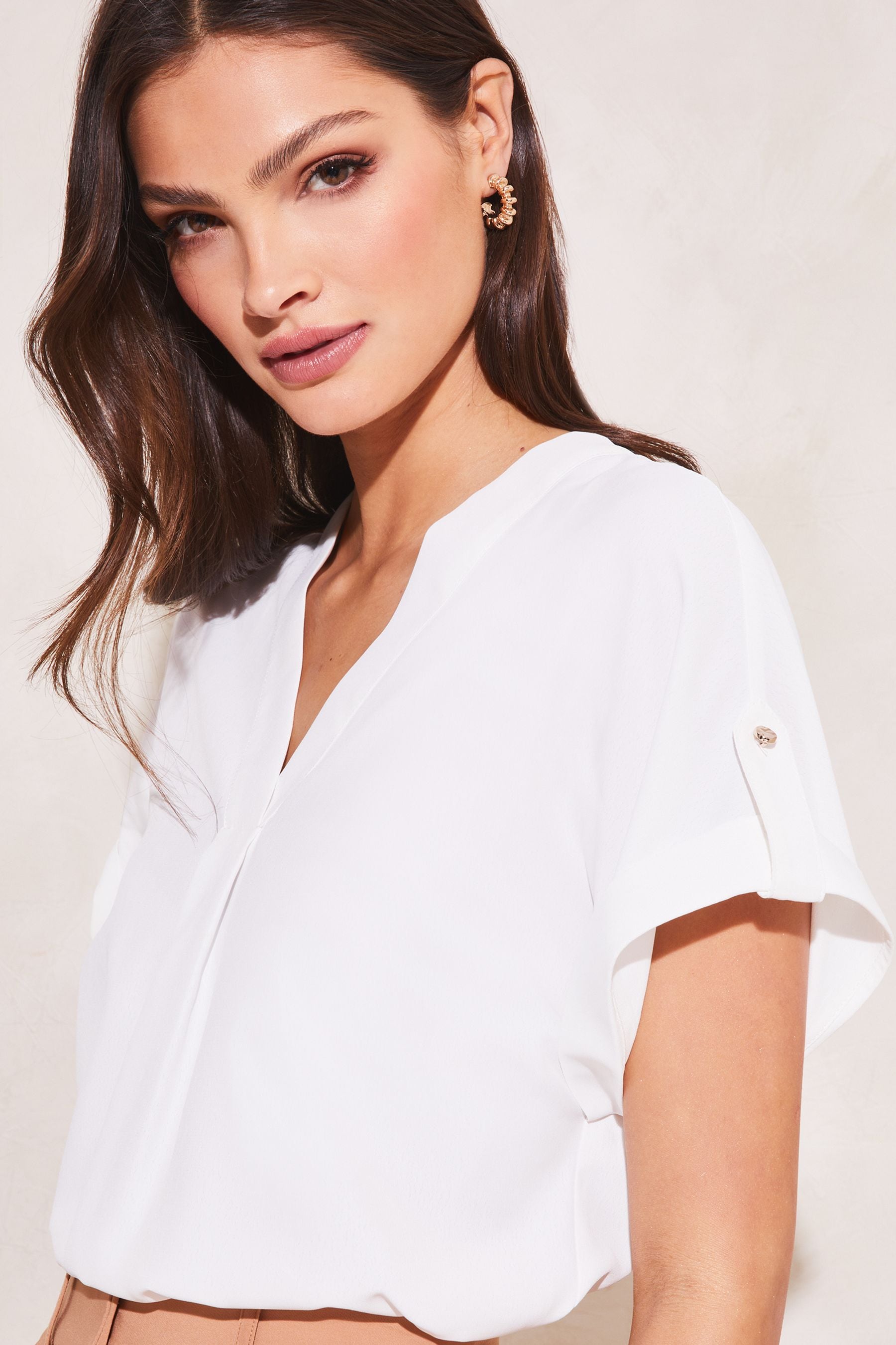 Buy Lipsy White Utility V Neck Short Roll Sleeve Top from the Next UK online shop