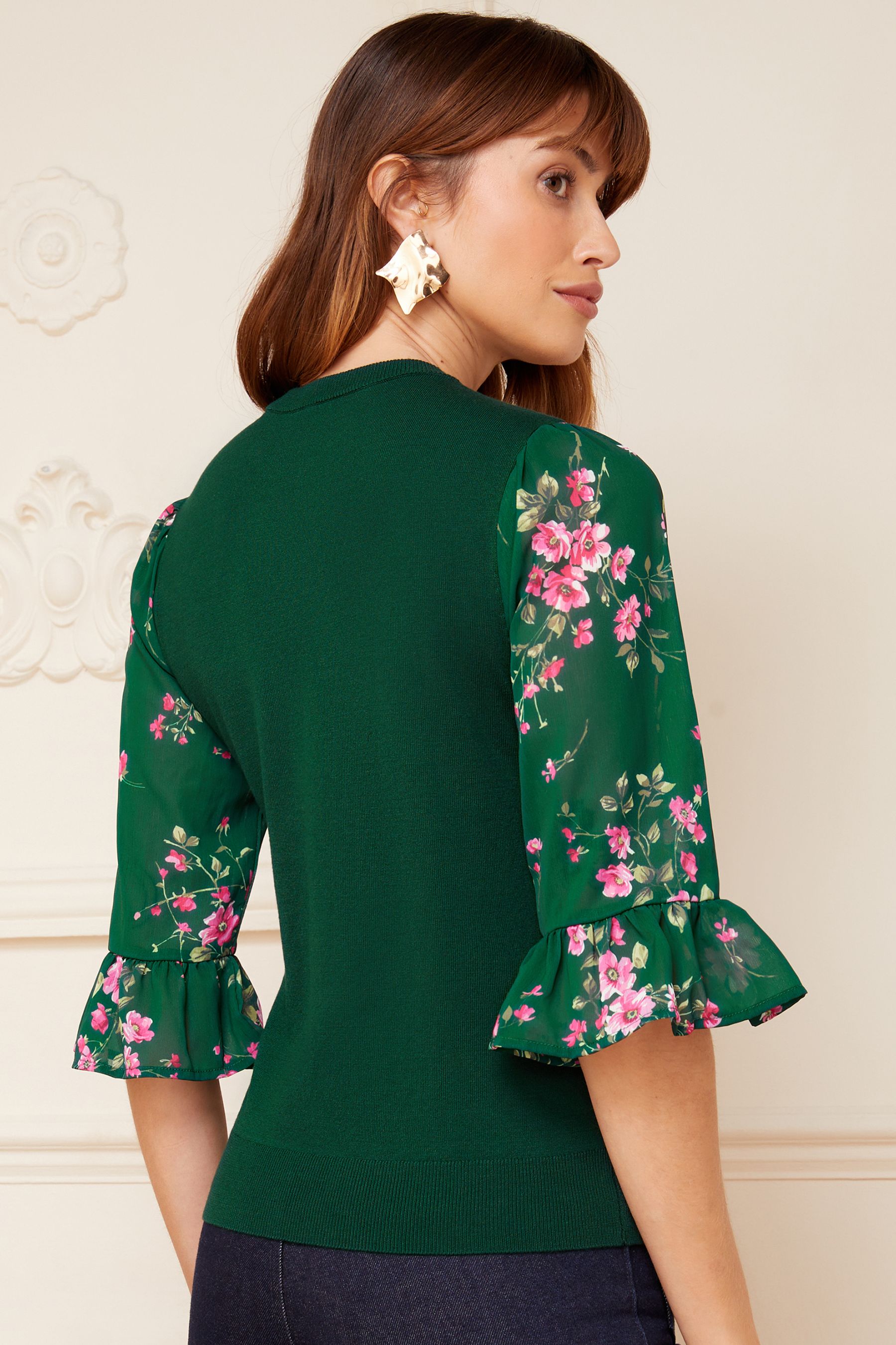 Jumper with roses on sleeves sales