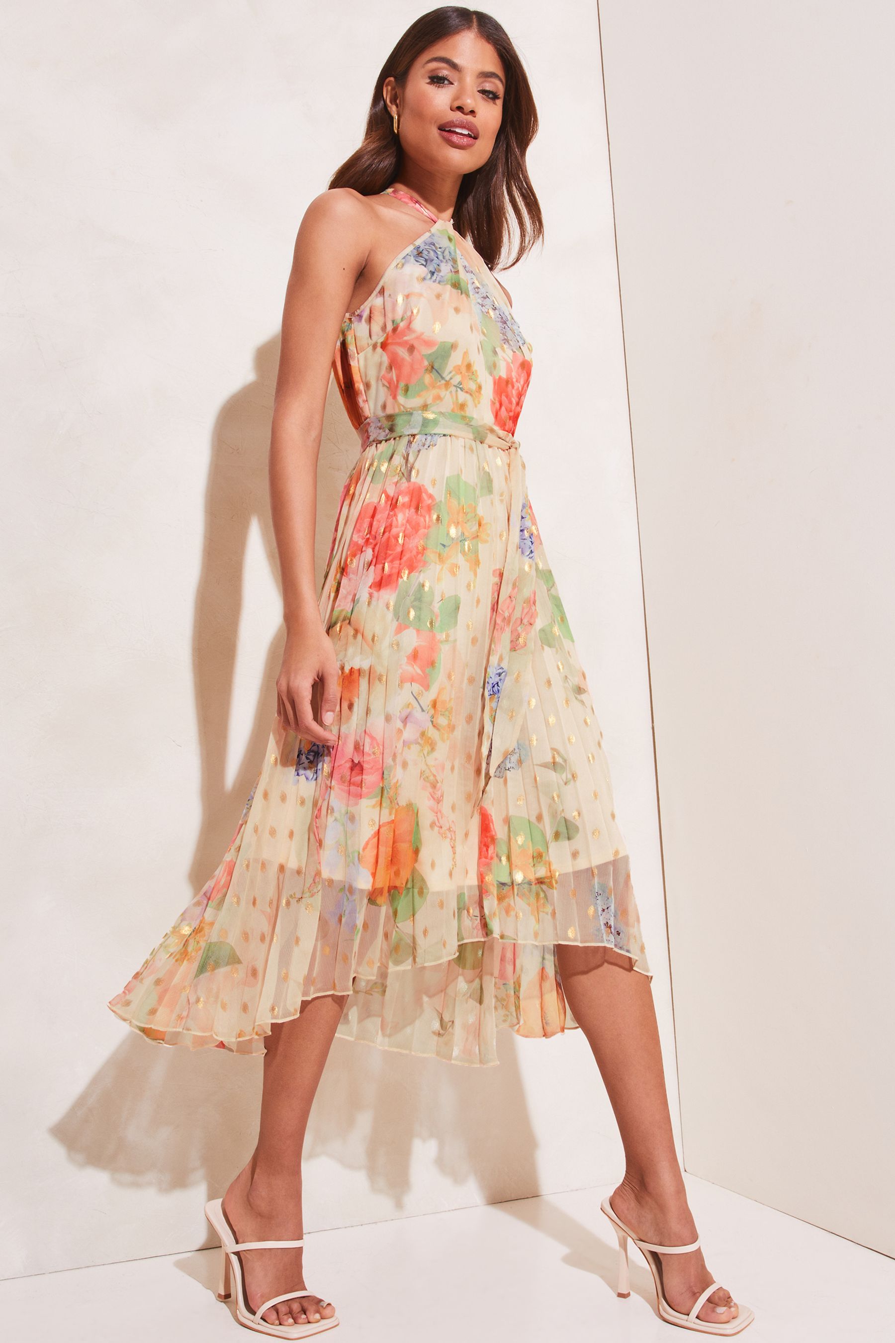 Buy Lipsy Cream Halterneck Pleated Hanky Hem Belted Midi Dress from Next Luxembourg
