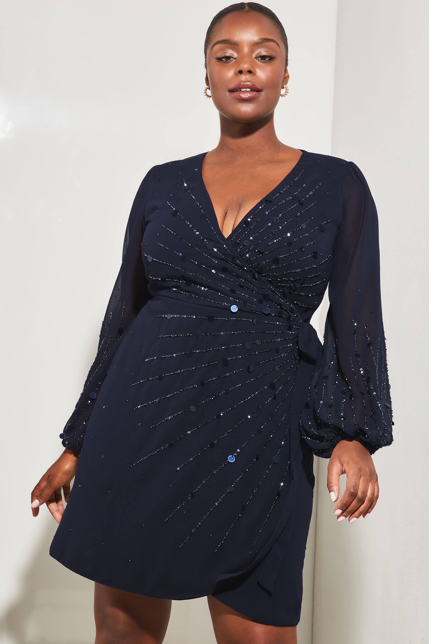 Buy Lipsy Navy Blue Curve Long Sleeve Hand Embellished Sequin Wrap Mini Shift Dress from Next Luxembourg