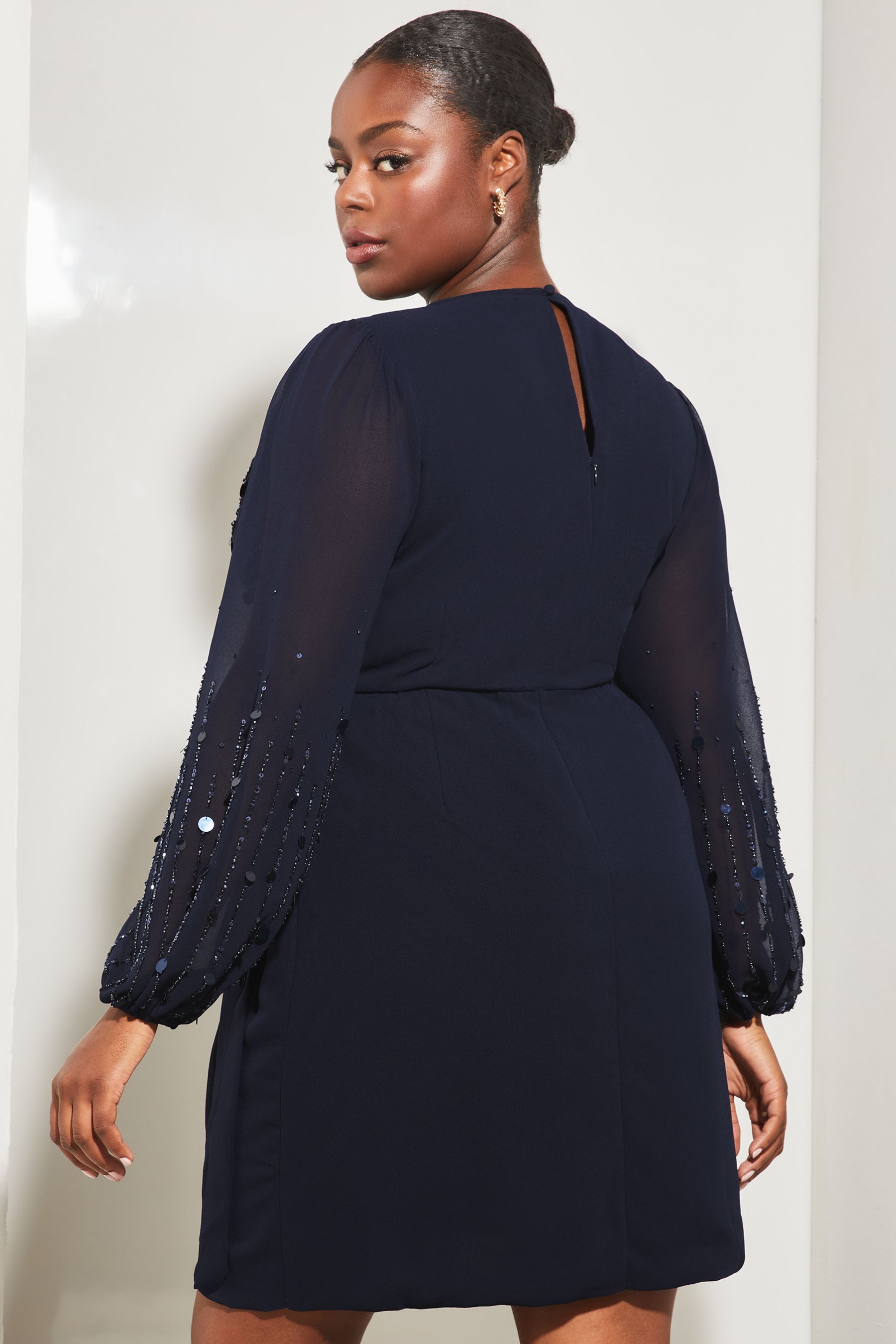 Buy Lipsy Navy Blue Curve Long Sleeve Hand Embellished Sequin Wrap Mini Shift Dress from Next Luxembourg
