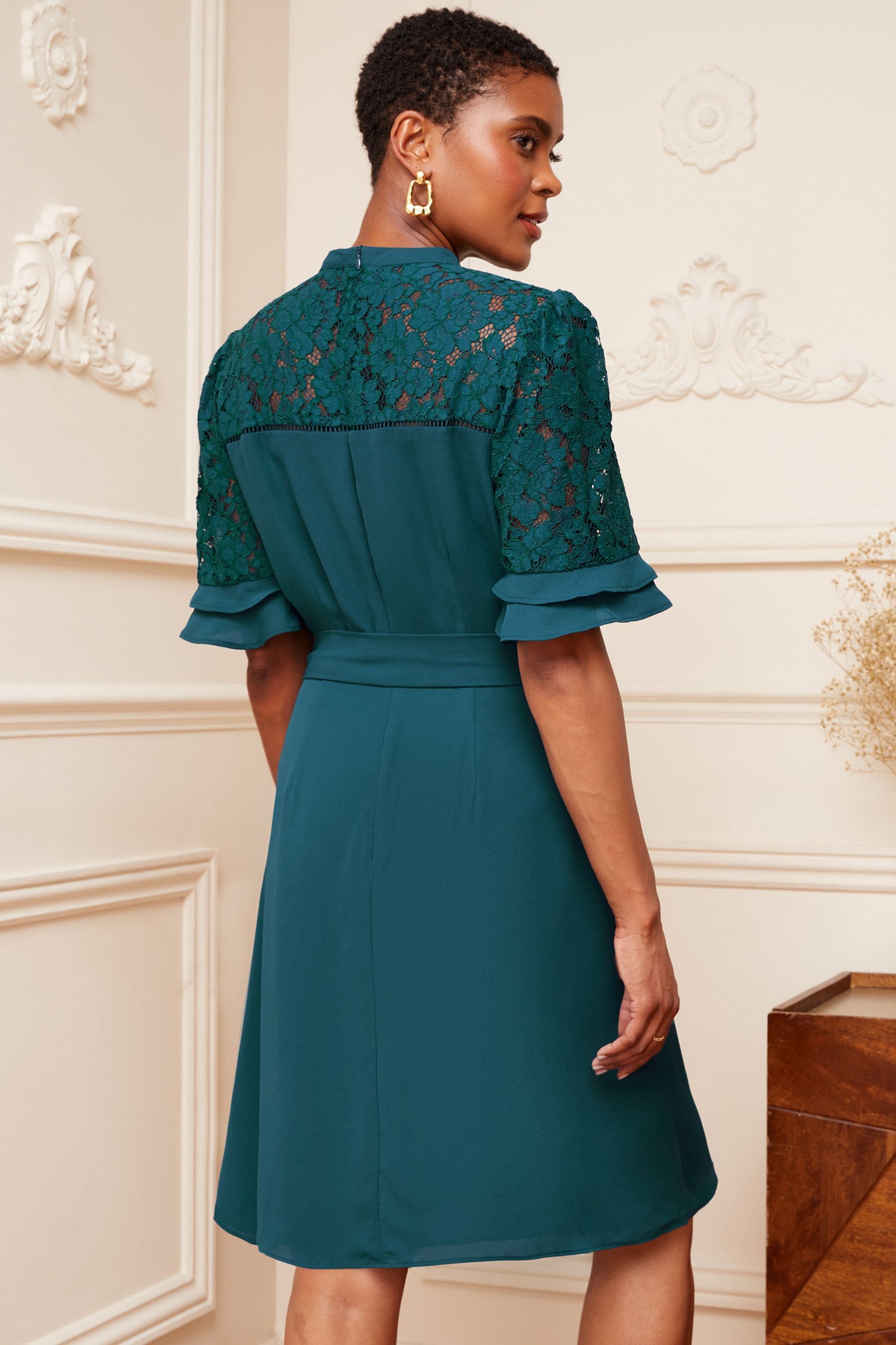 Buy Love Roses Teal Petite Lace Mix Yoke High Neck Tier Short Sleeve Belted Mini Dress from Next Luxembourg