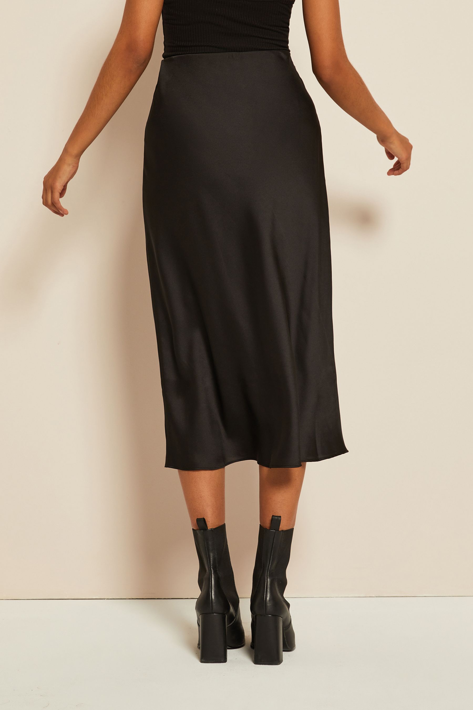 Buy Curves Like These Black Petite Satin Bias Midi Skirt from Next Belgium