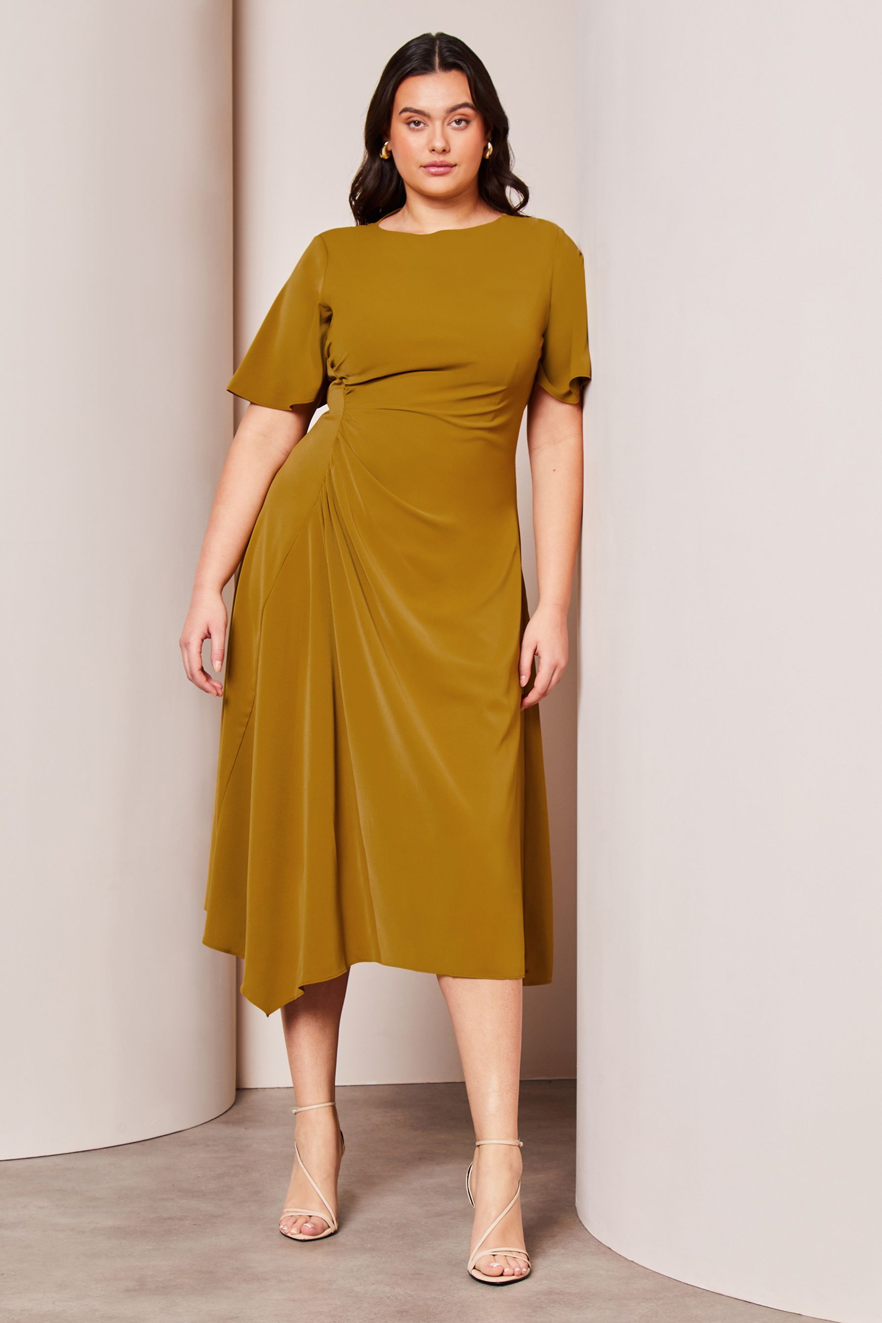 Buy Lipsy Green Curve Ruched Asymmetrical Flutter Sleeve Midi Dress from Next Luxembourg