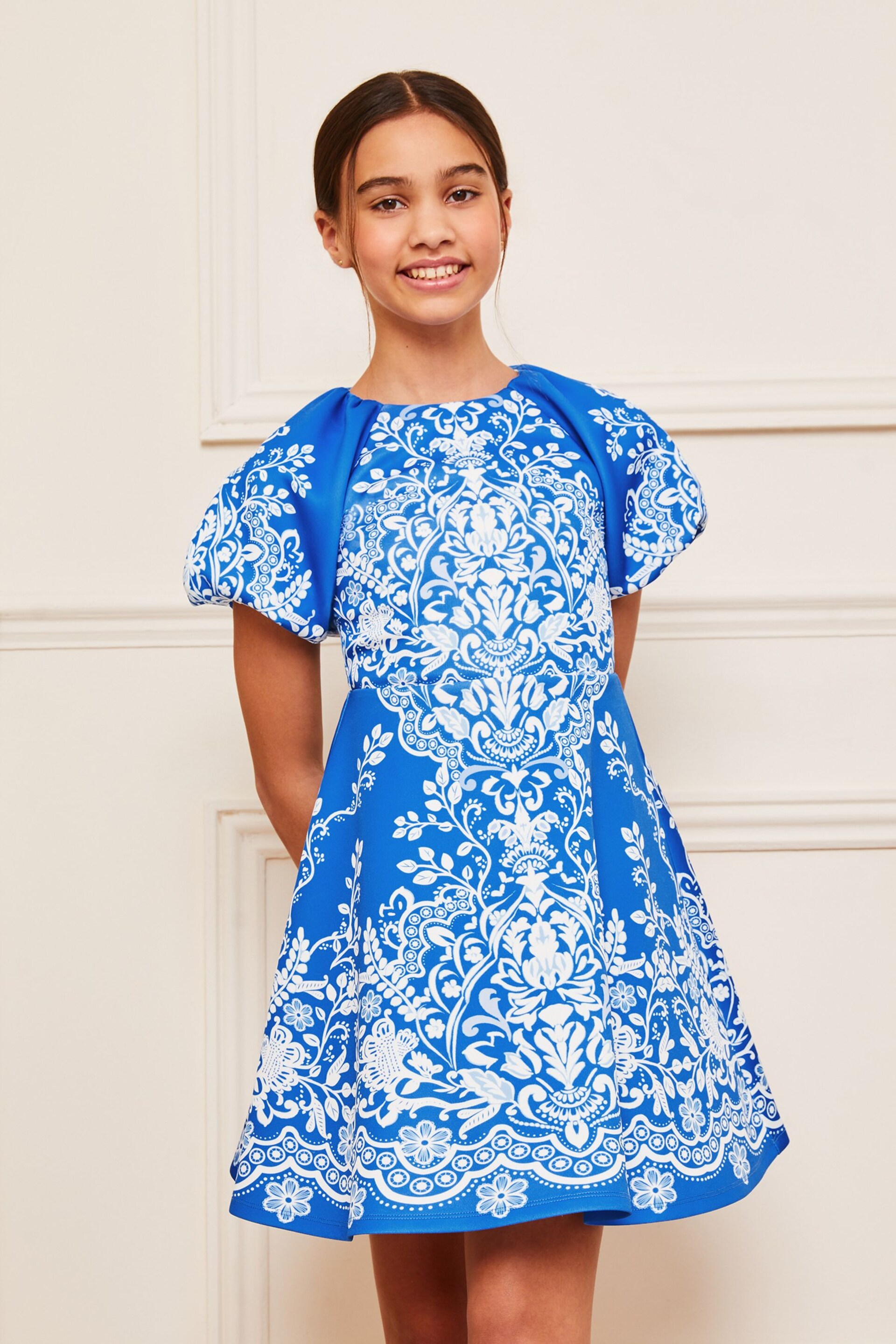 Lipsy Blue/White Print Puff Sleeve Scuba Occasion Dress (5-16yrs) - Image 1 of 4