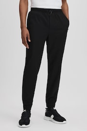 Reiss Onyx Black Dax Castore Water Repellent Track Pants - Image 1 of 8