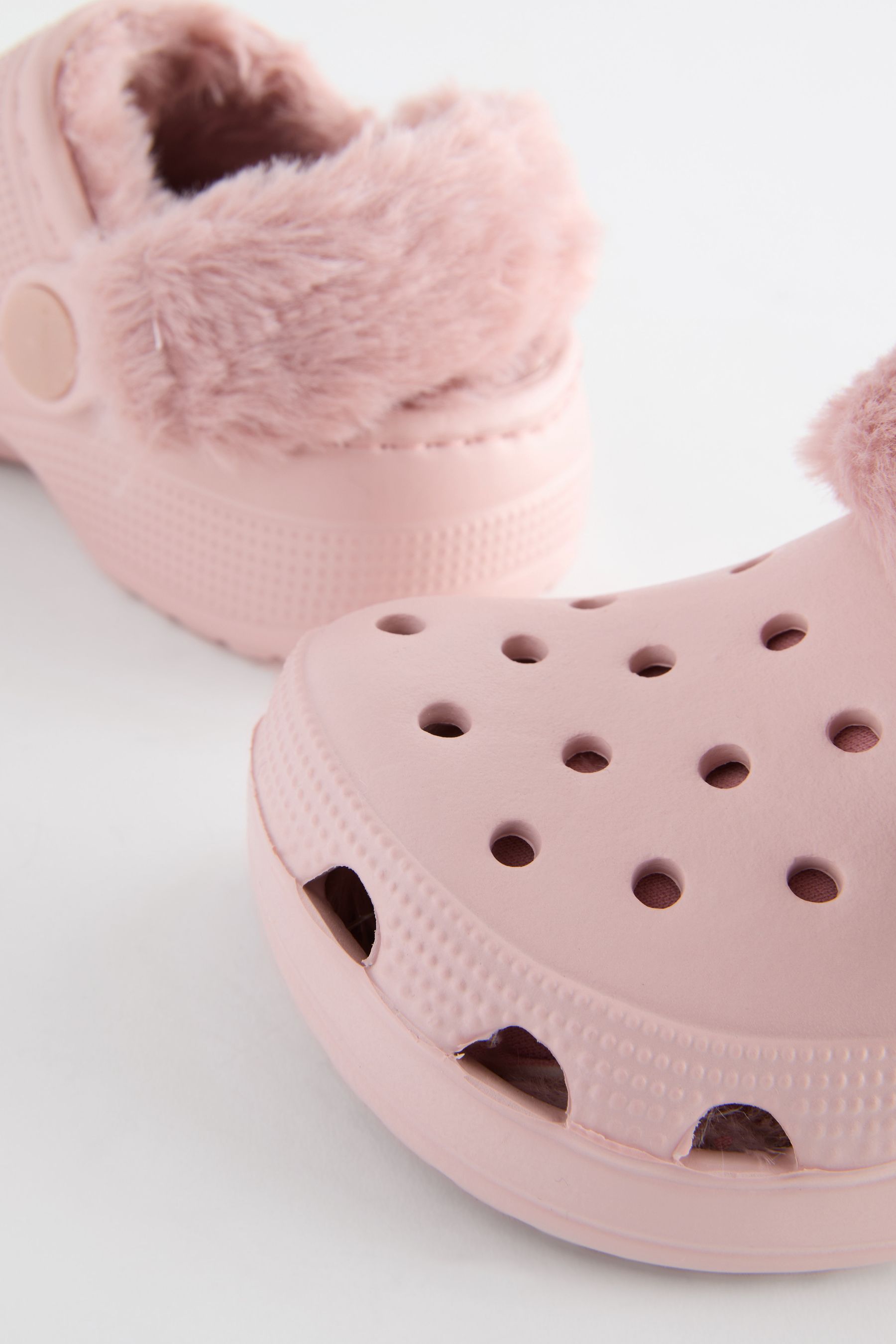 Pink crocs with fur inside top
