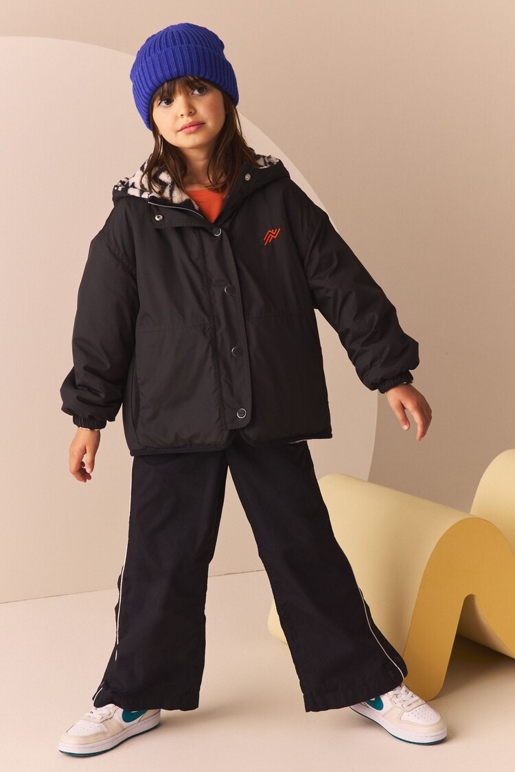 Buy Black/White Reversible Aztec Printed Fleece and Nylon Jacket