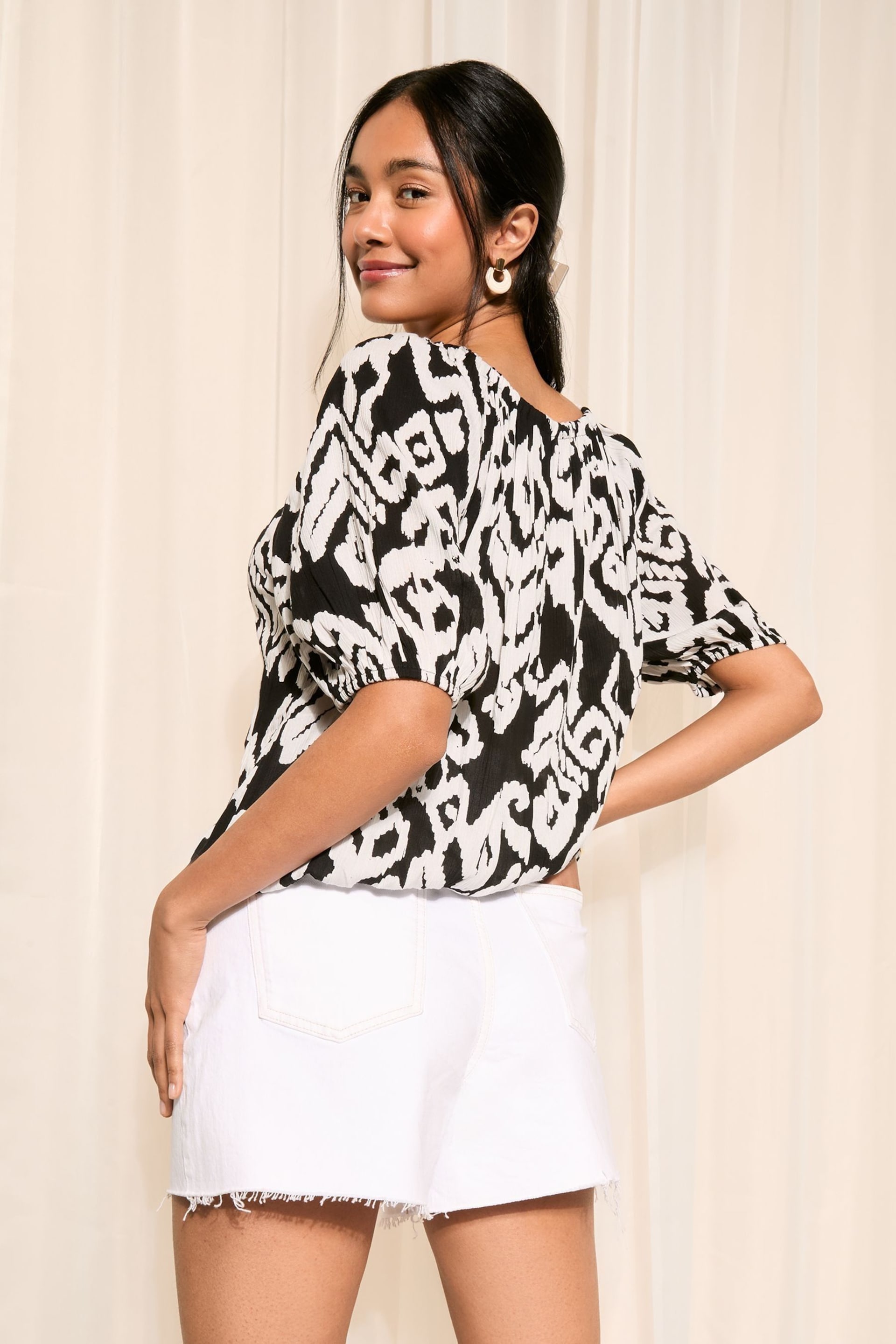 Friends Like These Black and White Ikat Tie Neck Bubble Hem Puff Sleeve Top - Image 4 of 4