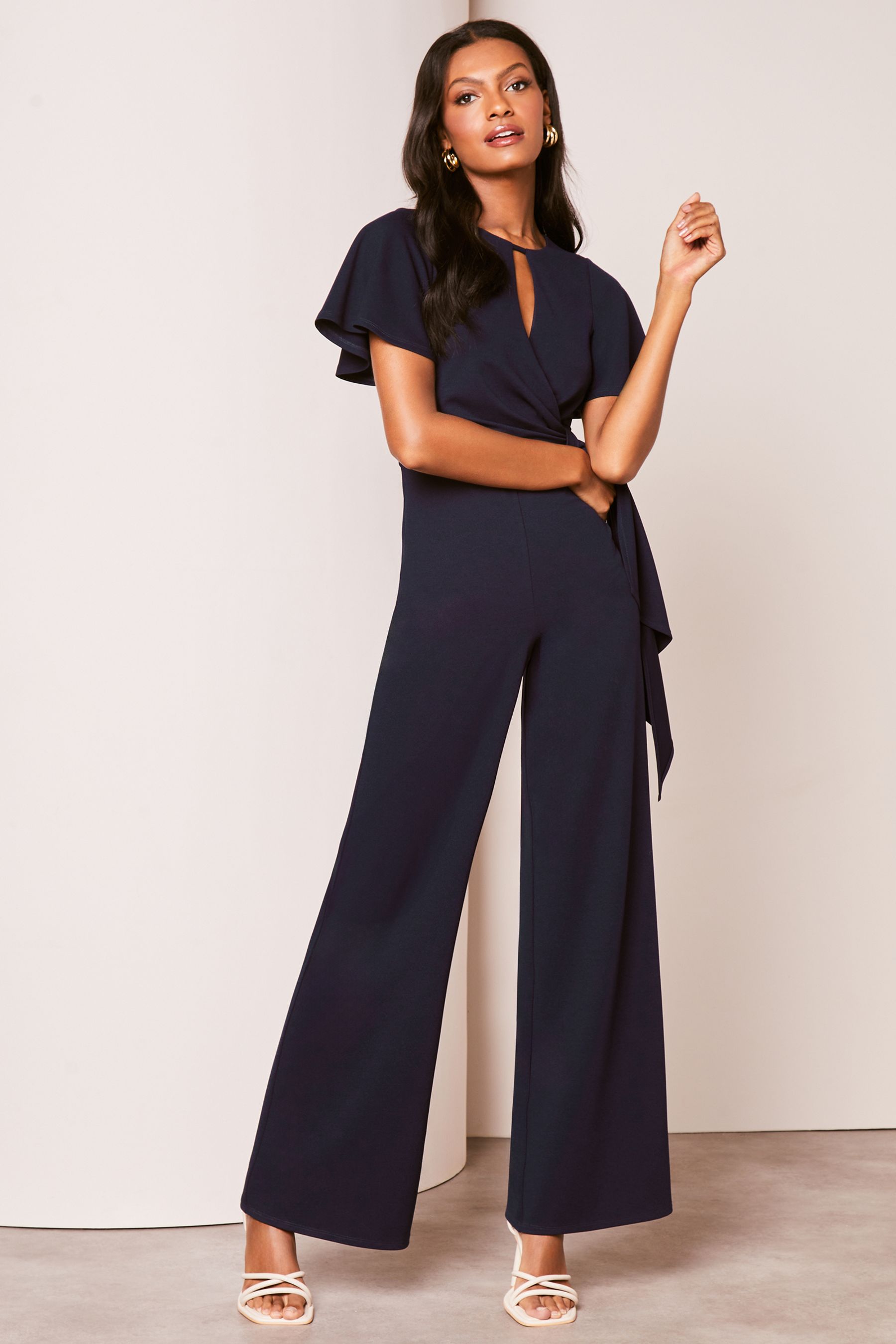 Buy Lipsy Navy Petite Flutter Sleeve Tie Side Wide Leg Jumpsuit from Next Netherlands