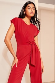 Friends Like These Red Short Sleeve Tie Waist Jumpsuit - Image 2 of 4