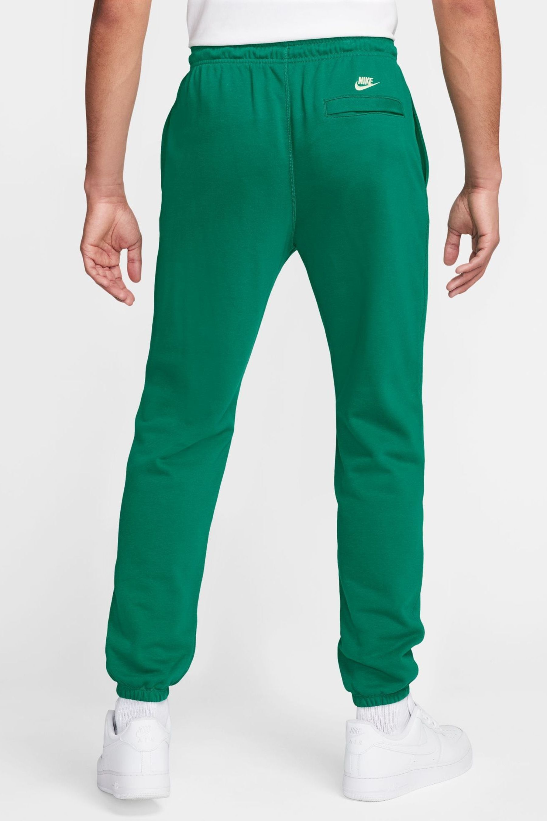 Buy Nike Green Club Printed Graphic Joggers from Next Luxembourg
