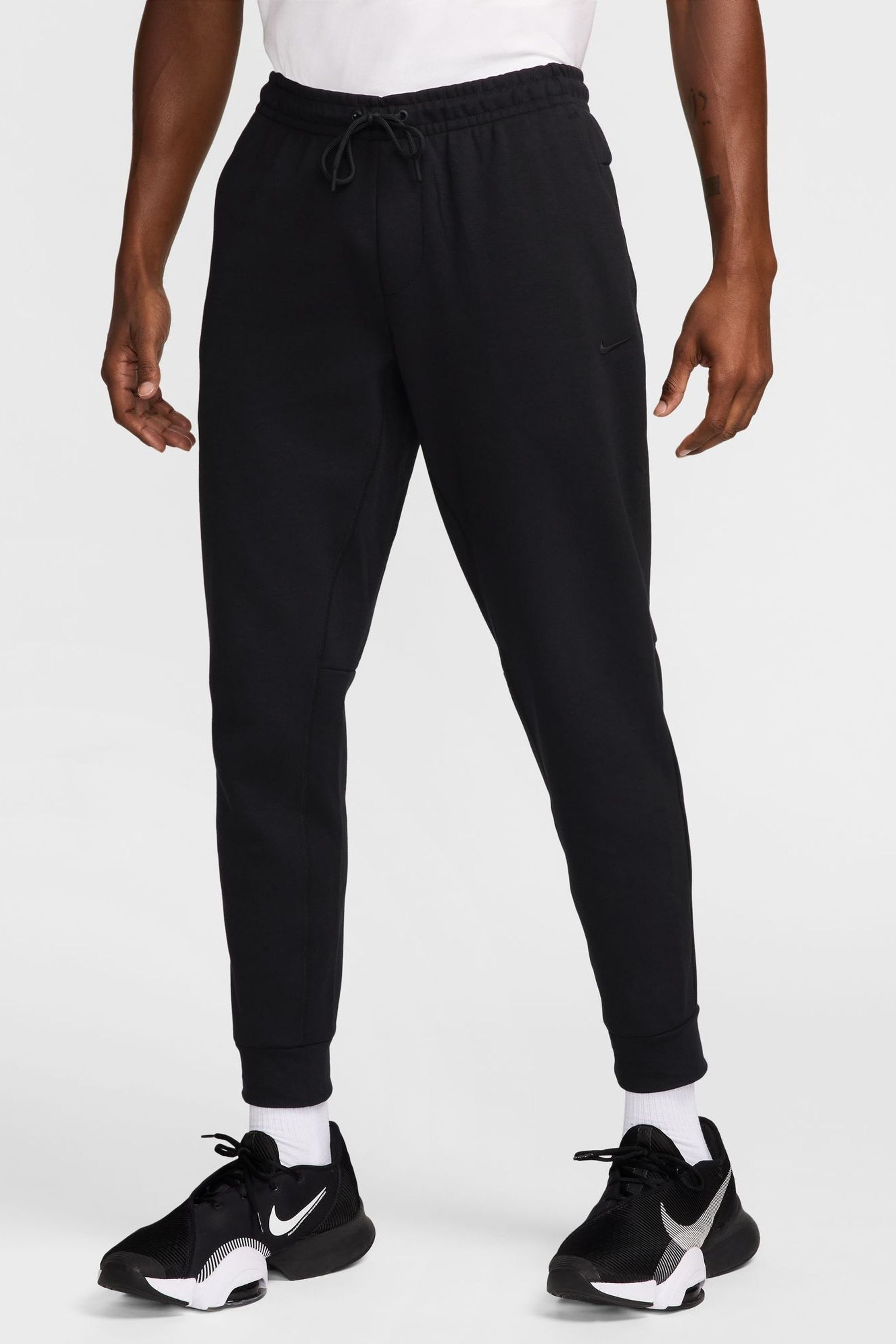 Buy Nike Black Primary Dri FIT UV Versatile Joggers from the Next UK online shop