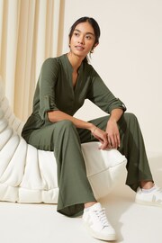 Friends Like These Khaki Green Petite Jersey Long Sleeve Cinched Waist Jumpsuit - Image 2 of 4