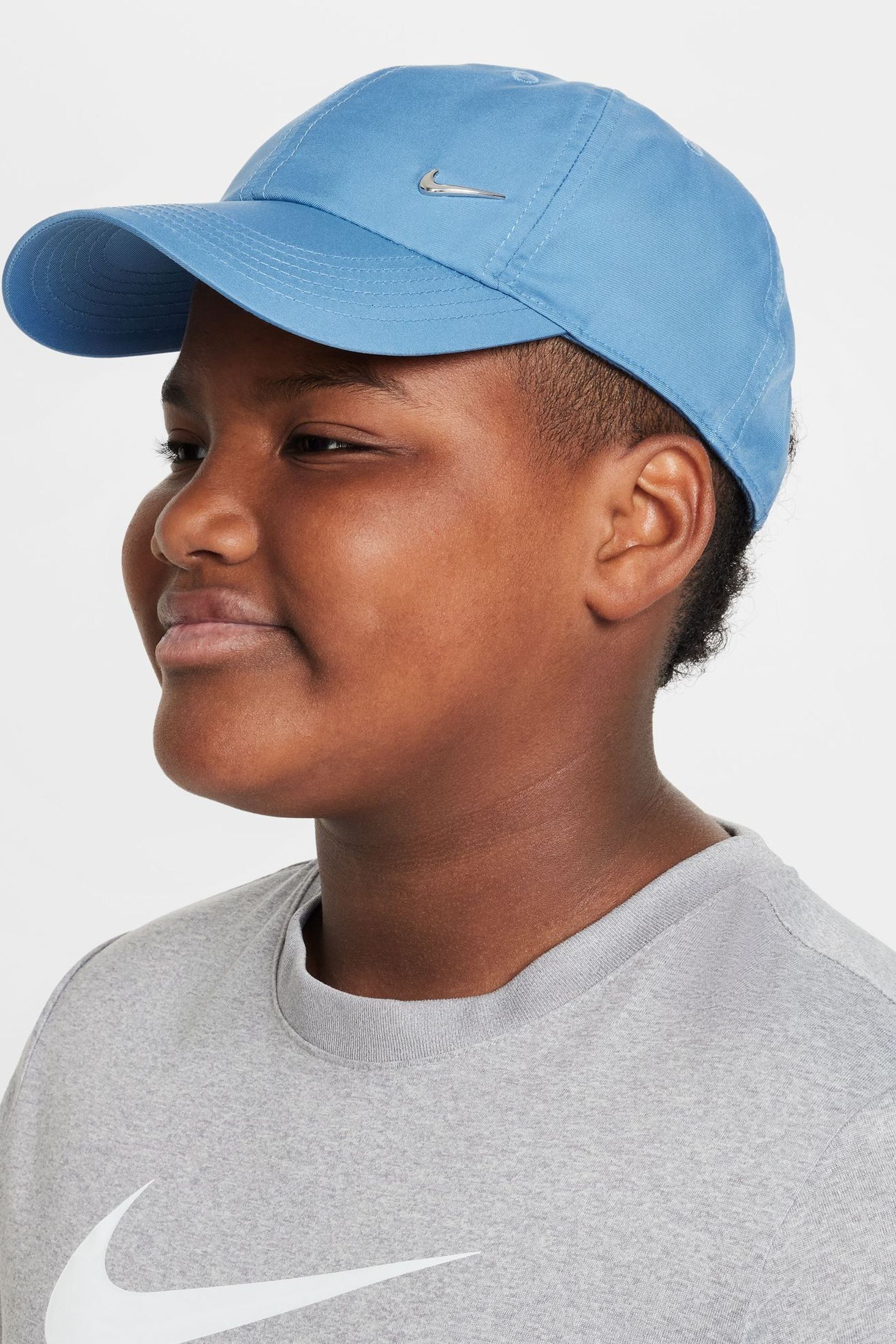 Buy Nike Blue Club Kids Dri FIT Unstructured Metal Swoosh Cap from Next Luxembourg