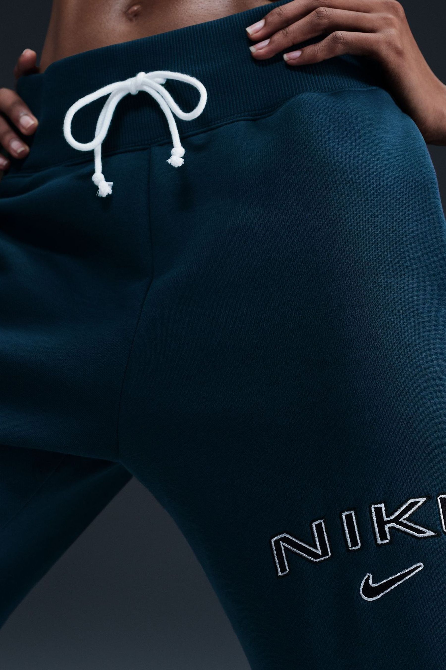 Buy Nike Teal Blue Phoenix Fleece Varsity High Waisted Wide Leg Logo Joggers from Next Germany