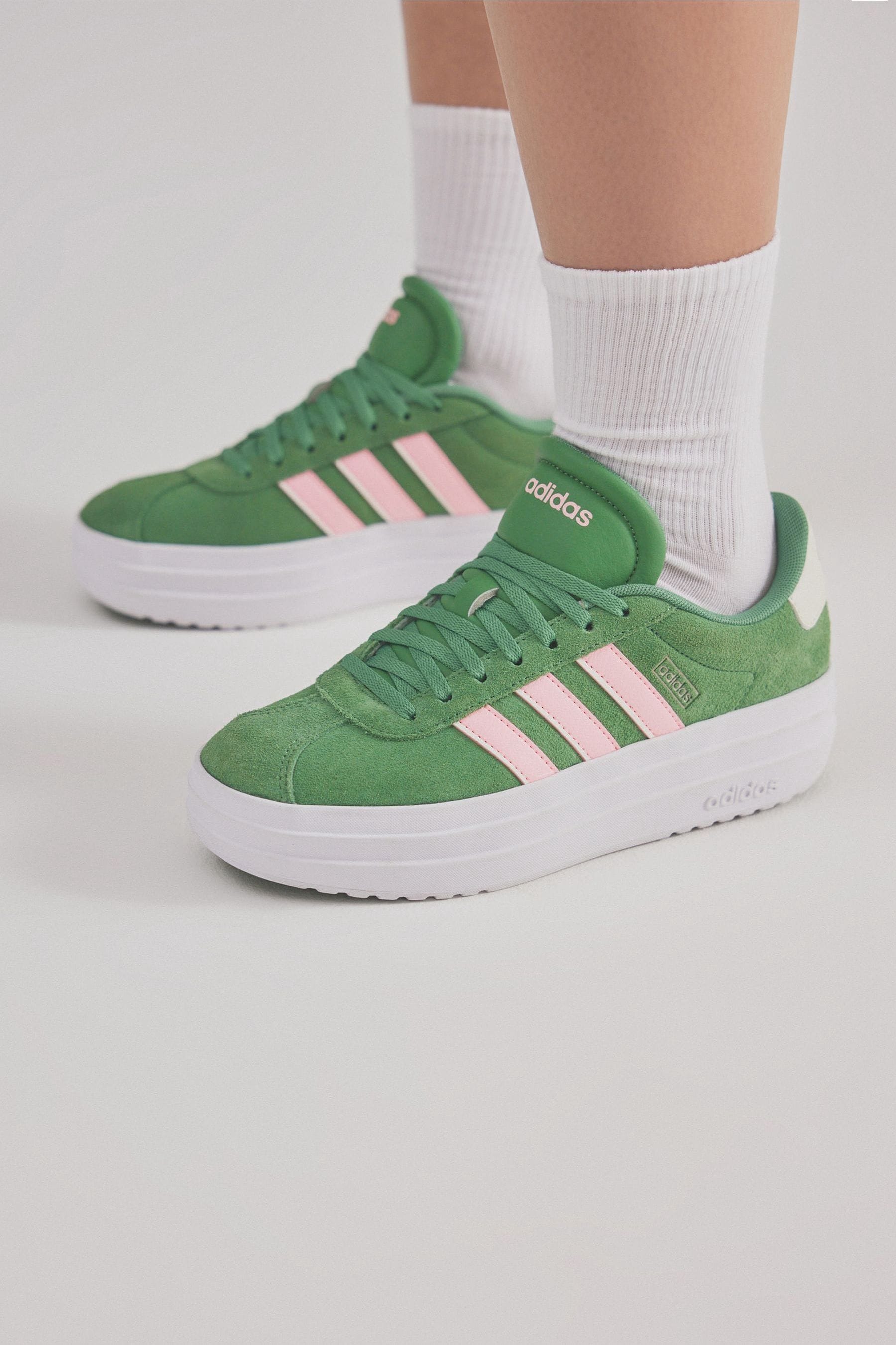 Gray and green shoe pink and white top