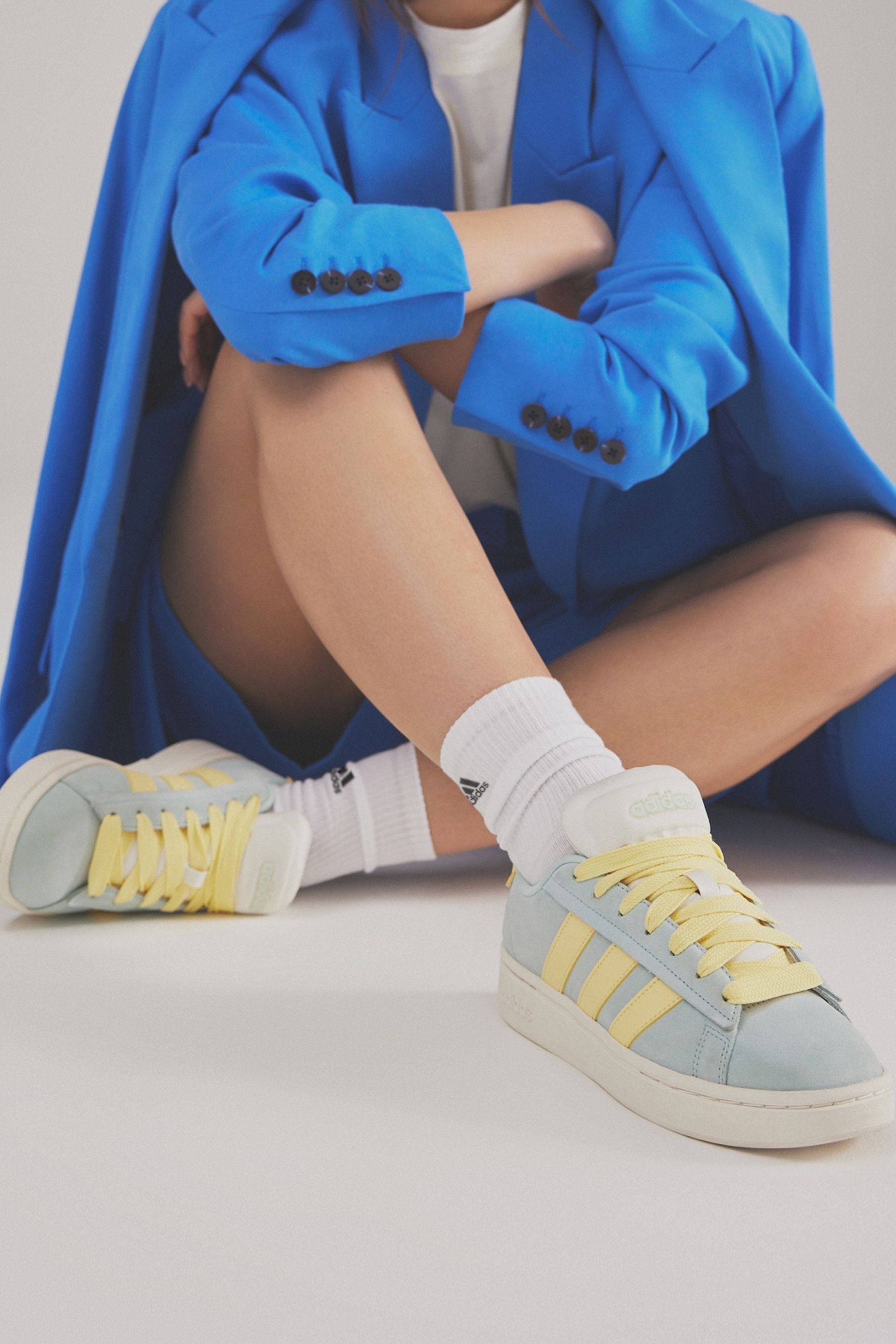 Adidas blue and yellow sneakers top