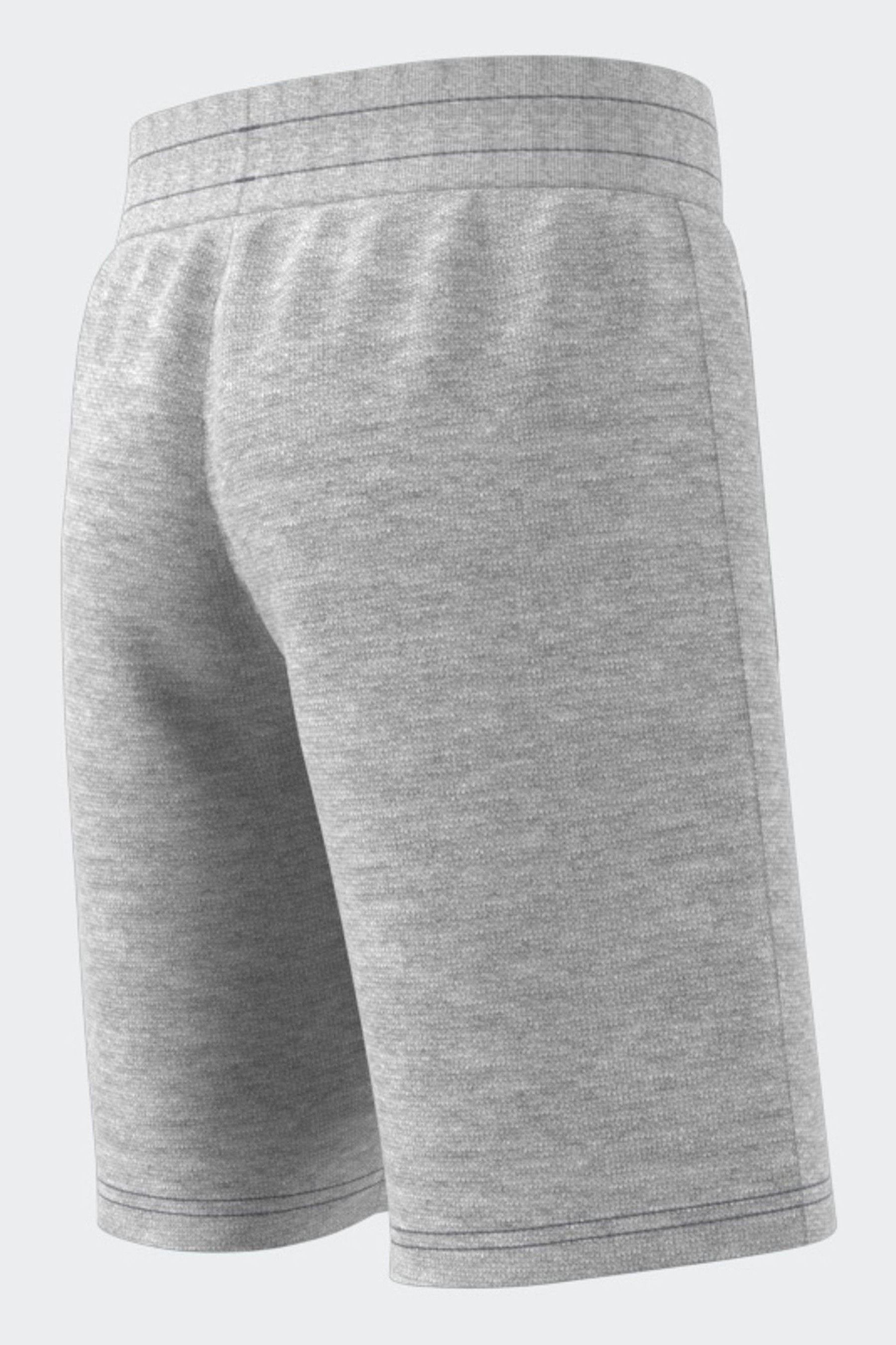 Grey and white adidas shorts top