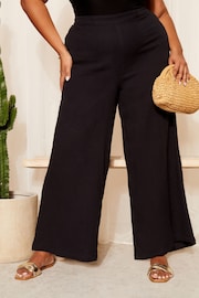 Curves Like These Black Linen Look Wide Leg Trousers - Image 1 of 4