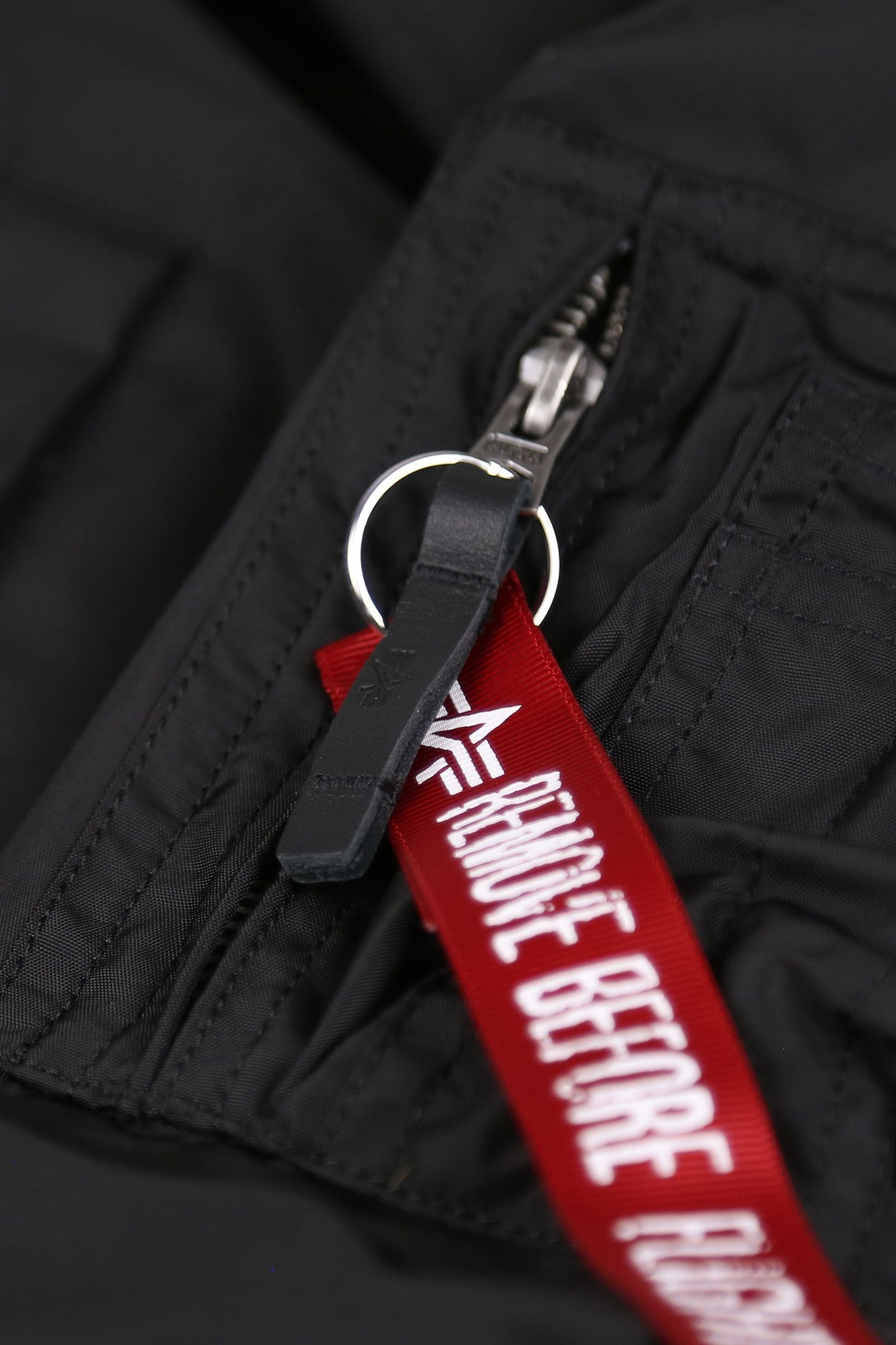 Remove before flight jacket tag hotsell