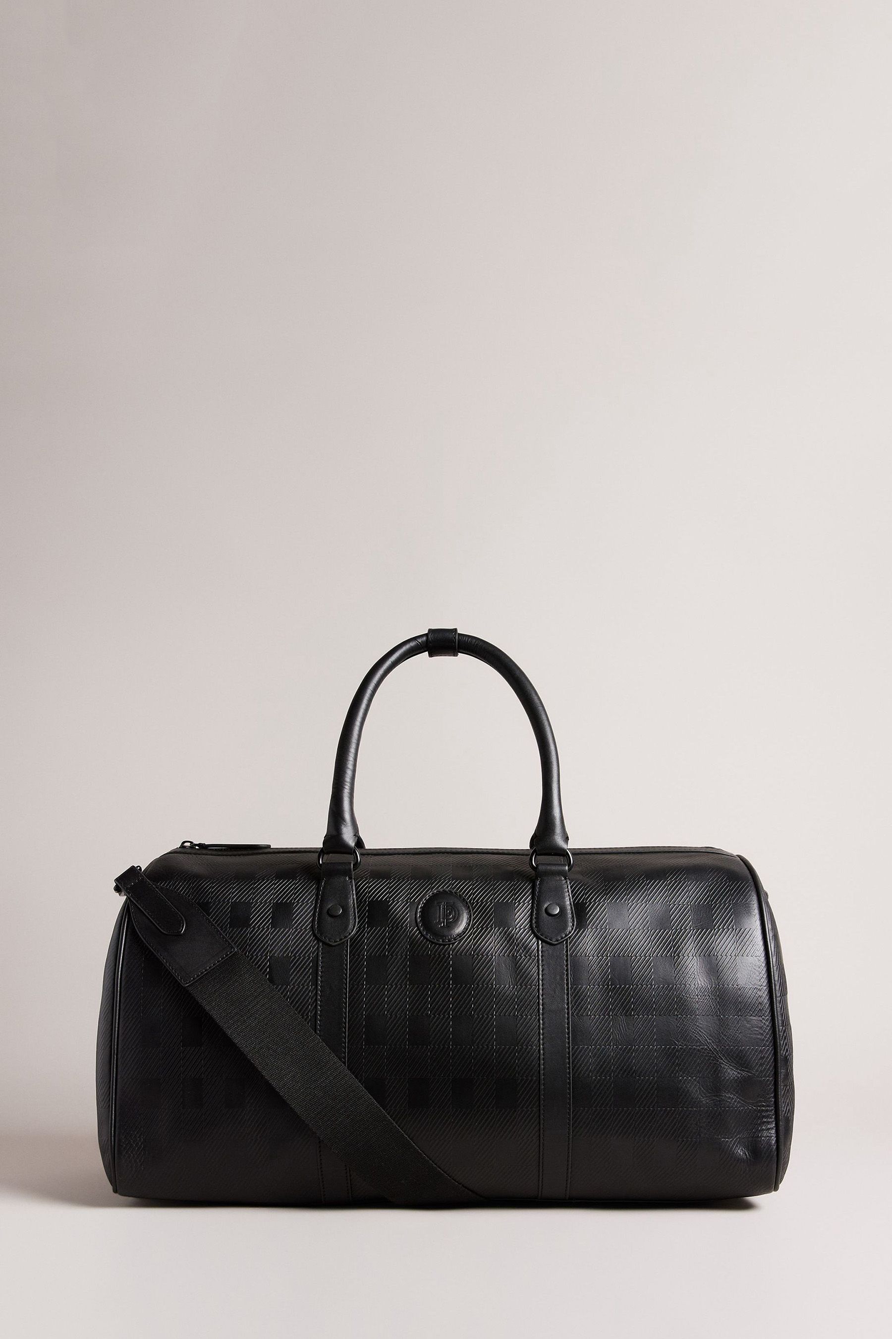 Buy Ted Baker Cheksen Black House Check Debossed Holdall Bag from Next Latvia