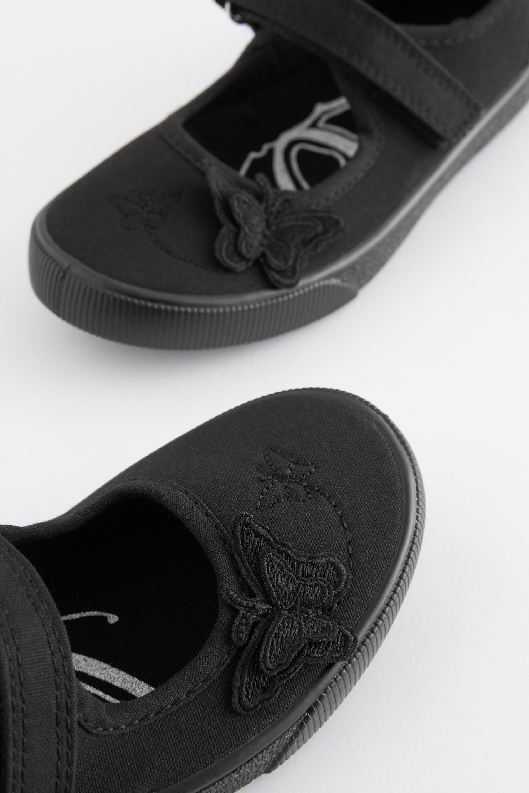 Buy Black Wide Fit G Butterfly Embroidered School Plimsoll Shoes from Next Canada