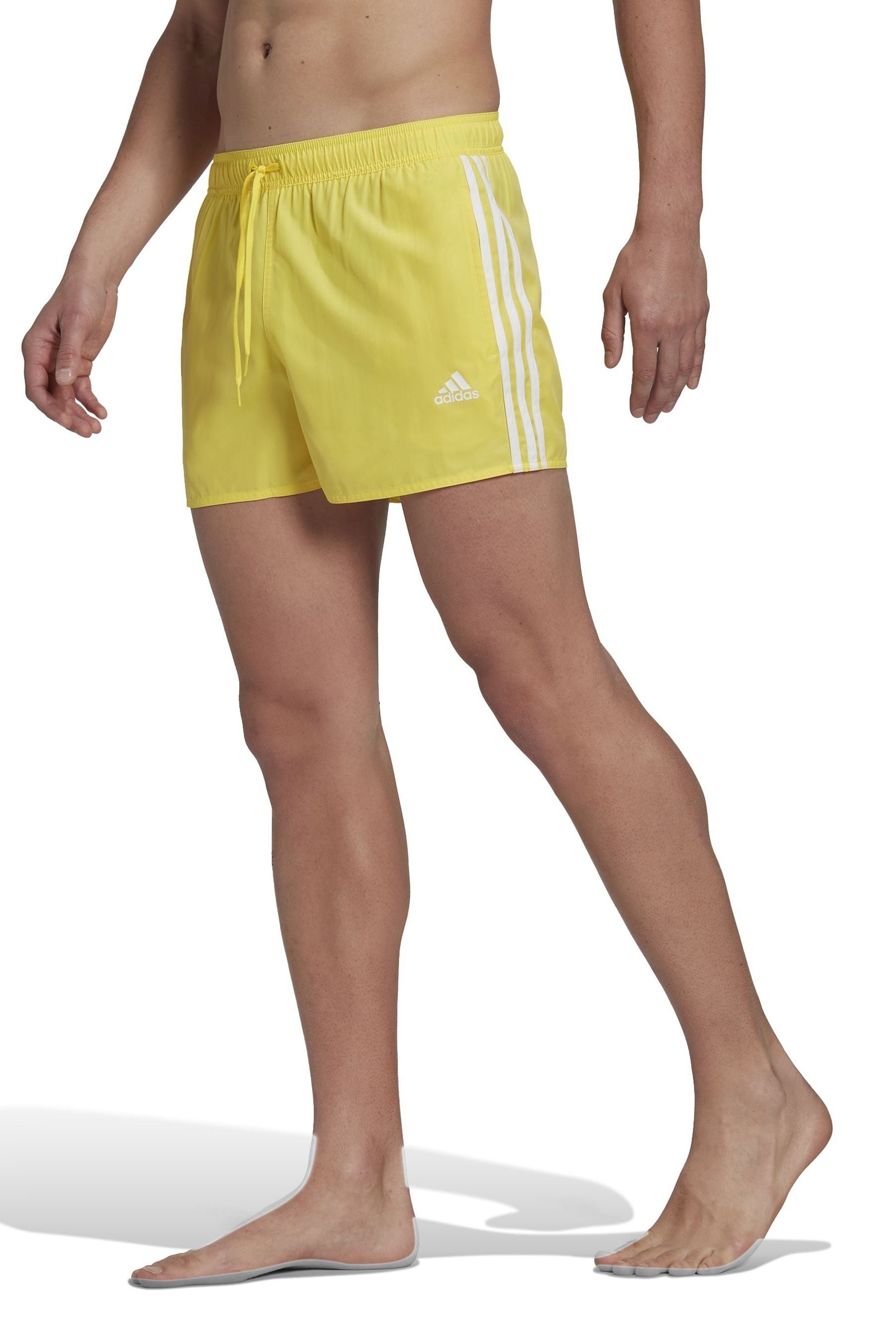 Yellow adidas swim shorts top