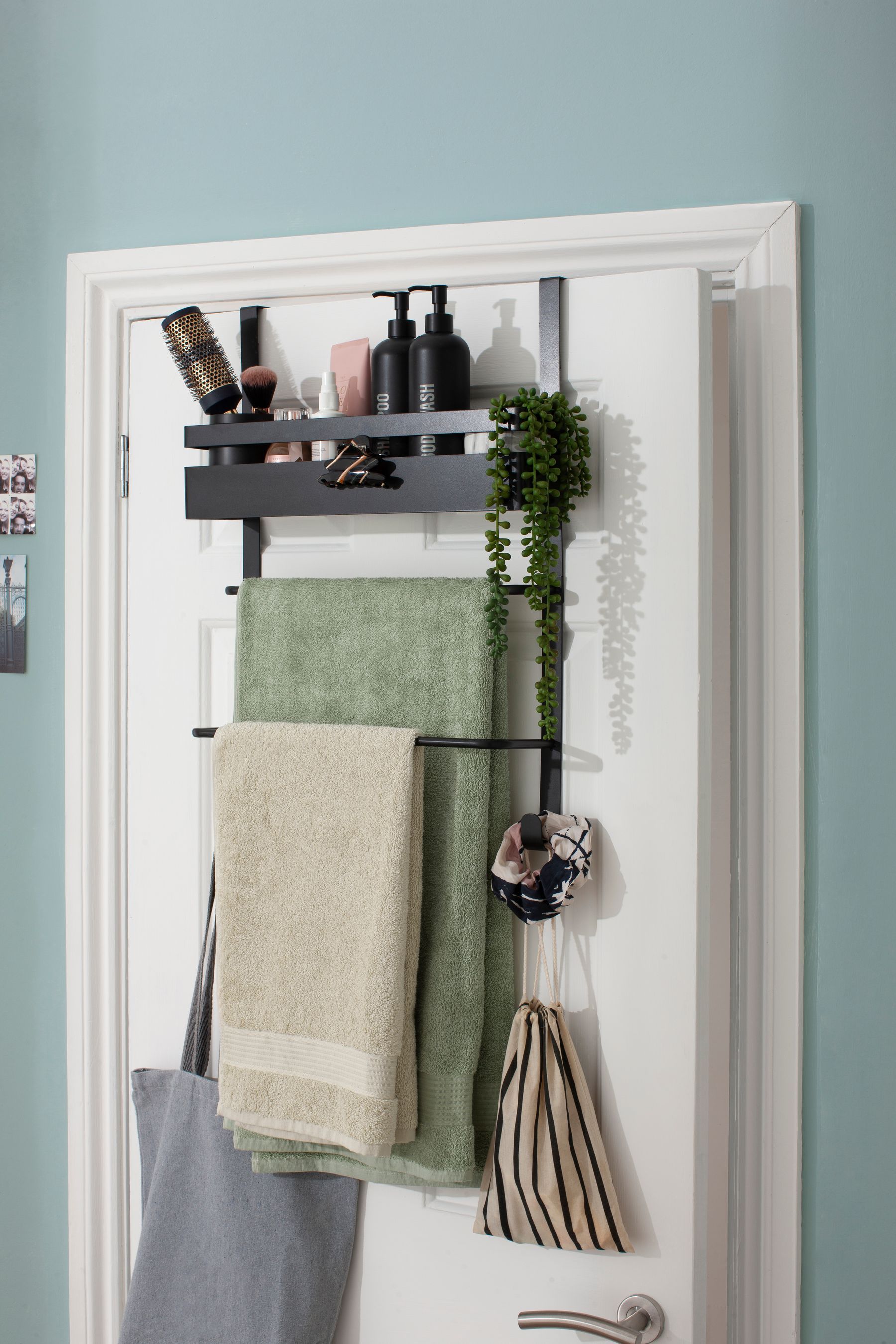 Bathroom door mounted towel rack top