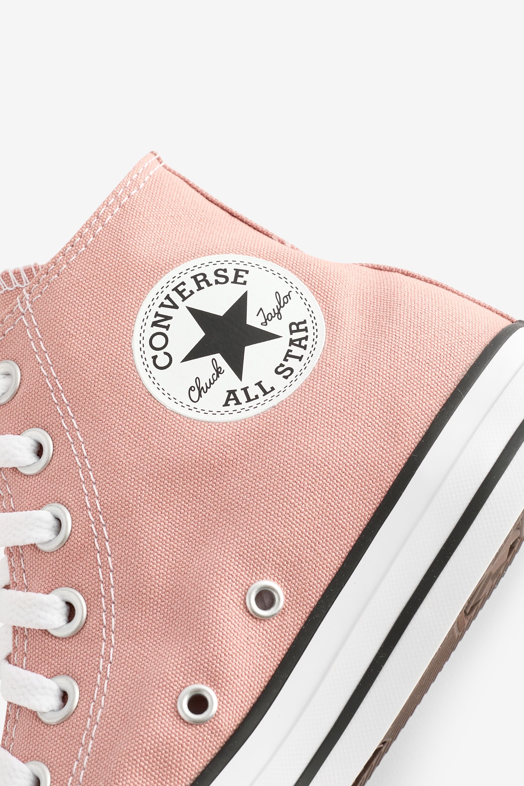 Light pink converse shoes top