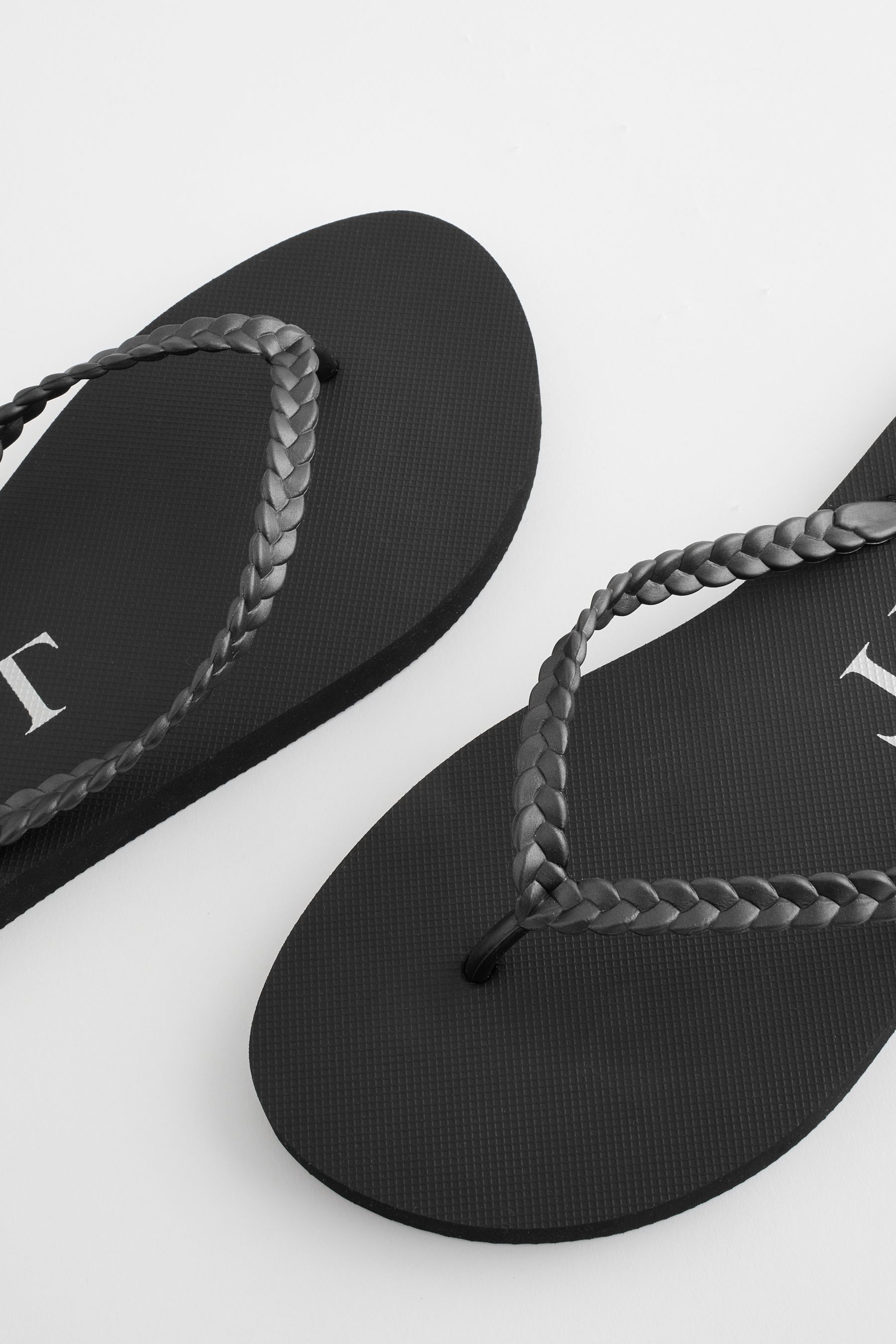 Buy Black Pearlised Plaited Flip Flops from the Next UK online shop