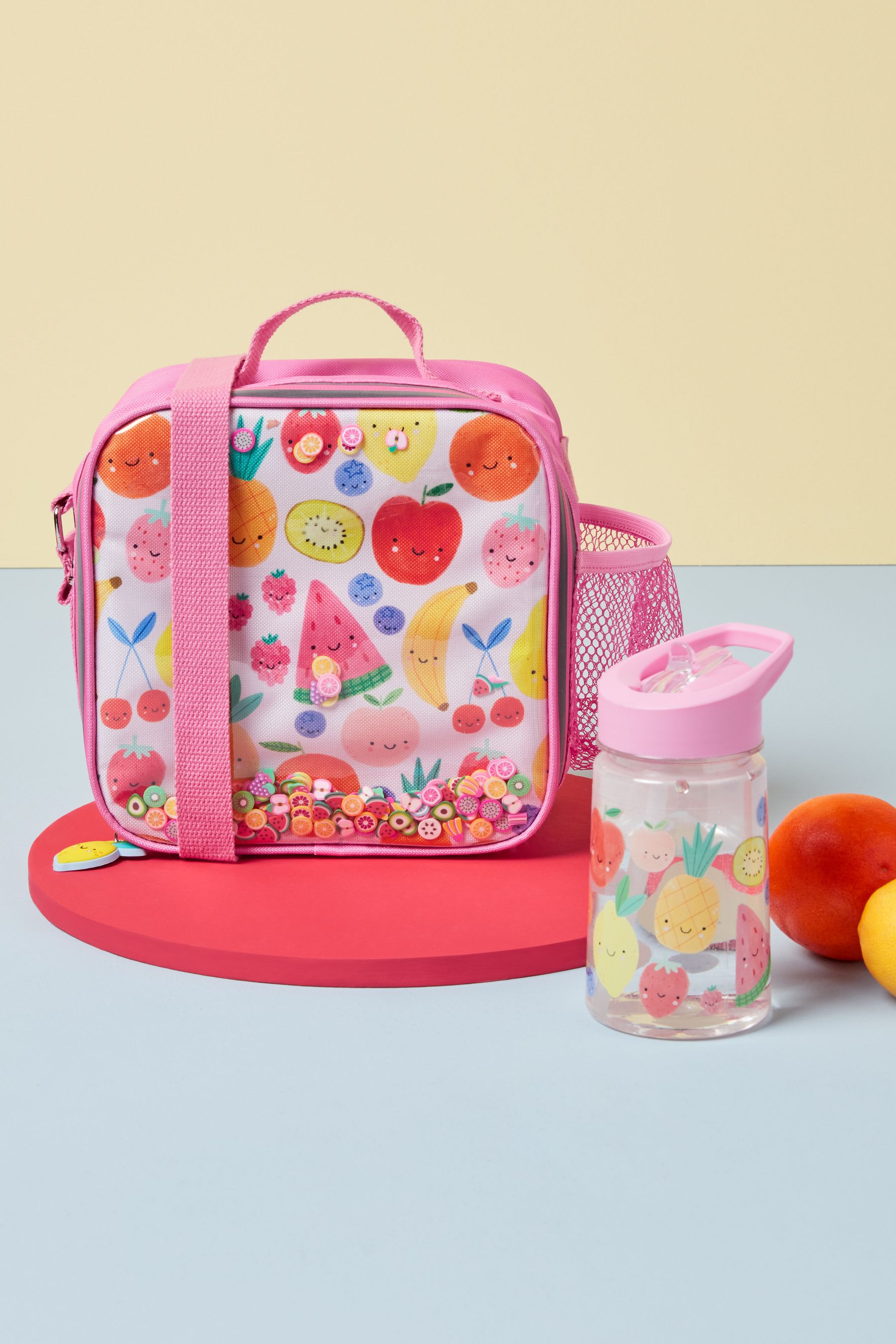 Buy Pink Fruit Print Lunch Bag and Water Bottle Set from the Next UK online shop