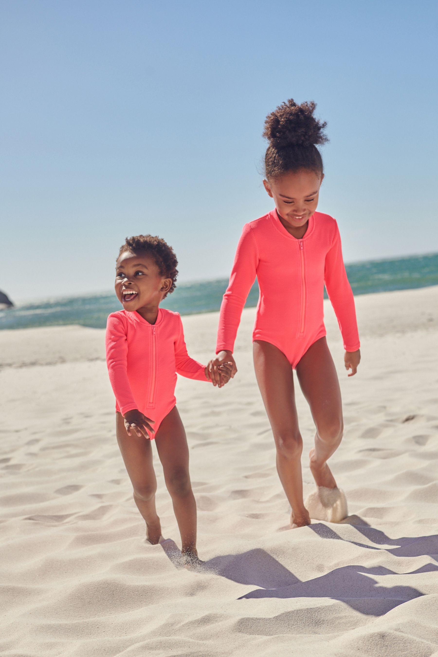 Red long sleeve swimsuit on sale