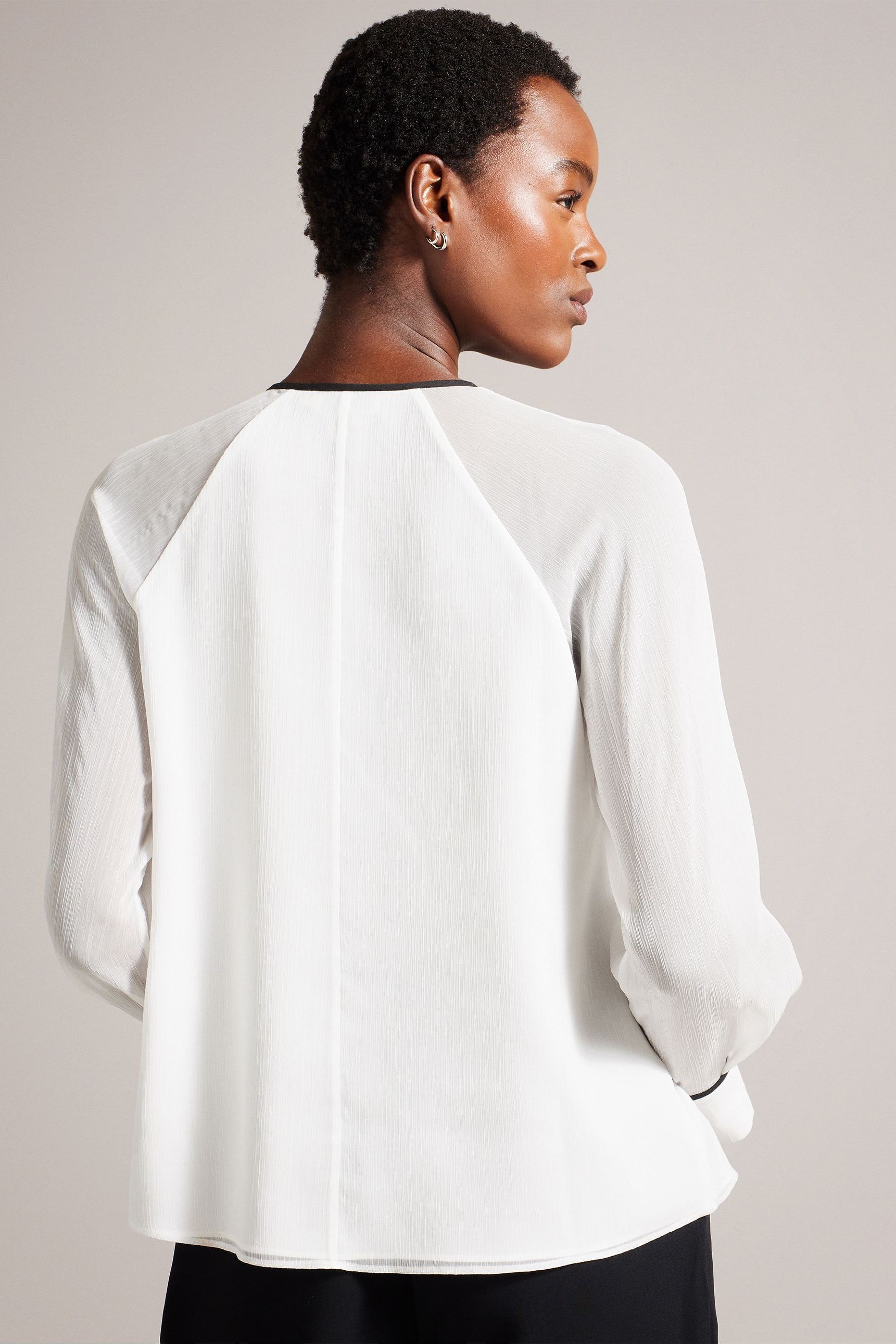 Ruffle front white blouse shop