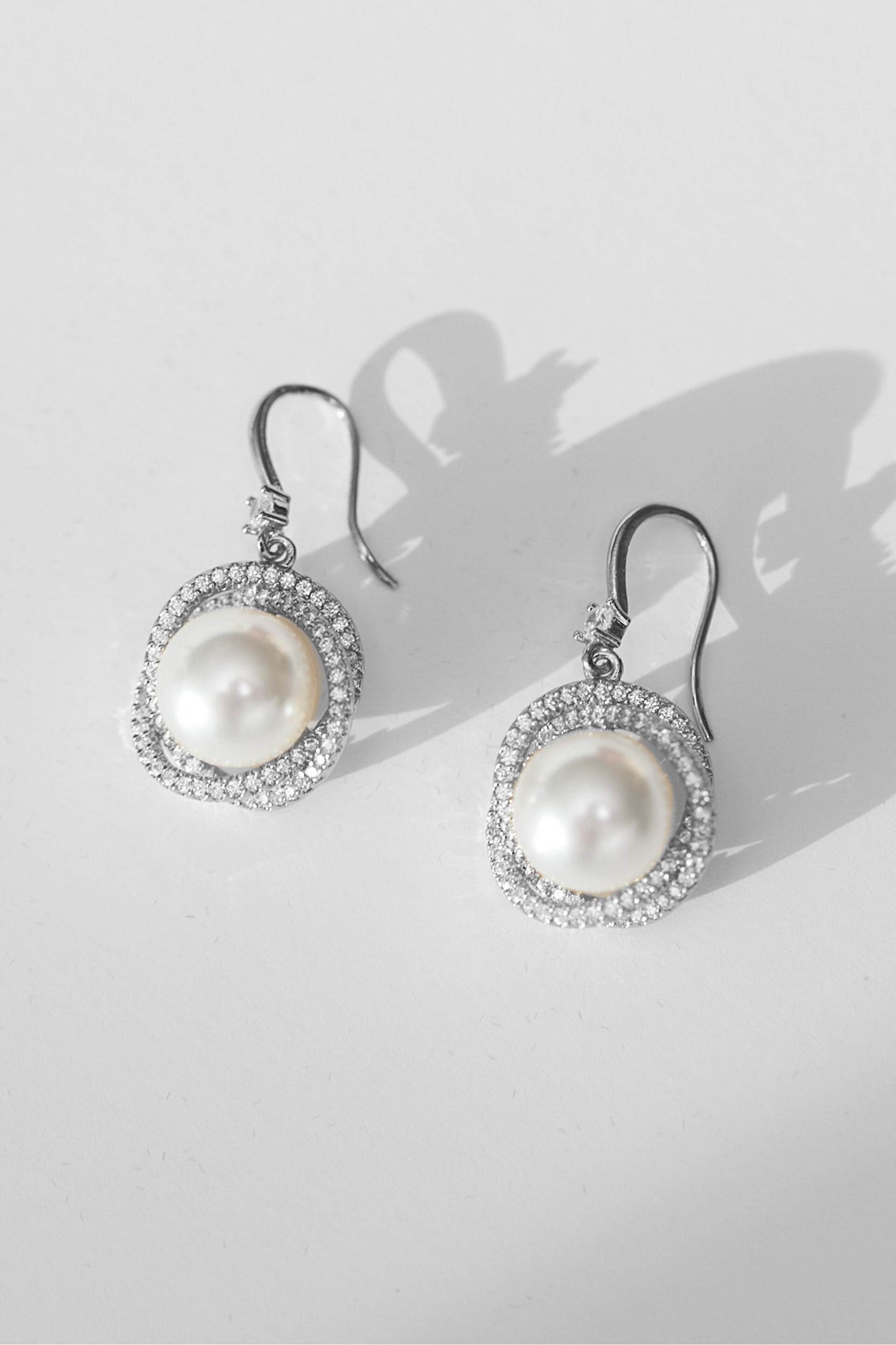 Jon Richard Silver Tone Cubic Zirconia Knotted Pearl Centre Fish Hook Drop Earrings - Image 1 of 2
