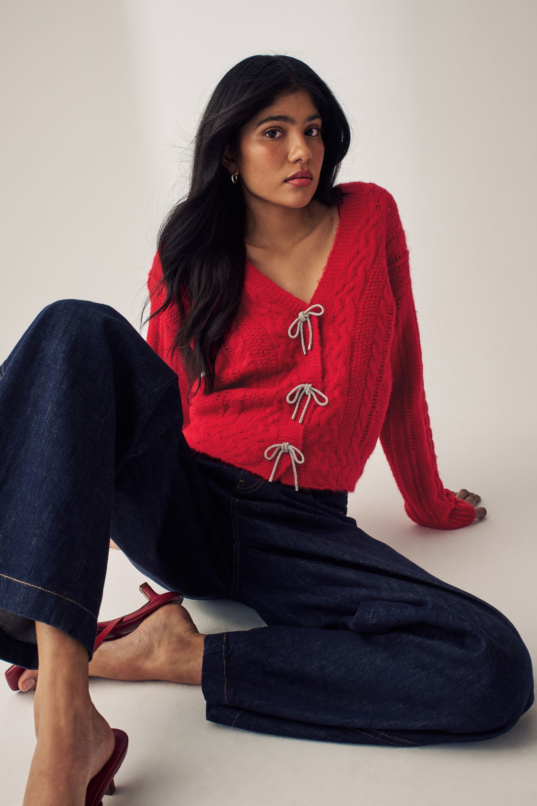 Buy Red Sparkle Bow Button Cable Knitted Cardigan from the Next UK online shop