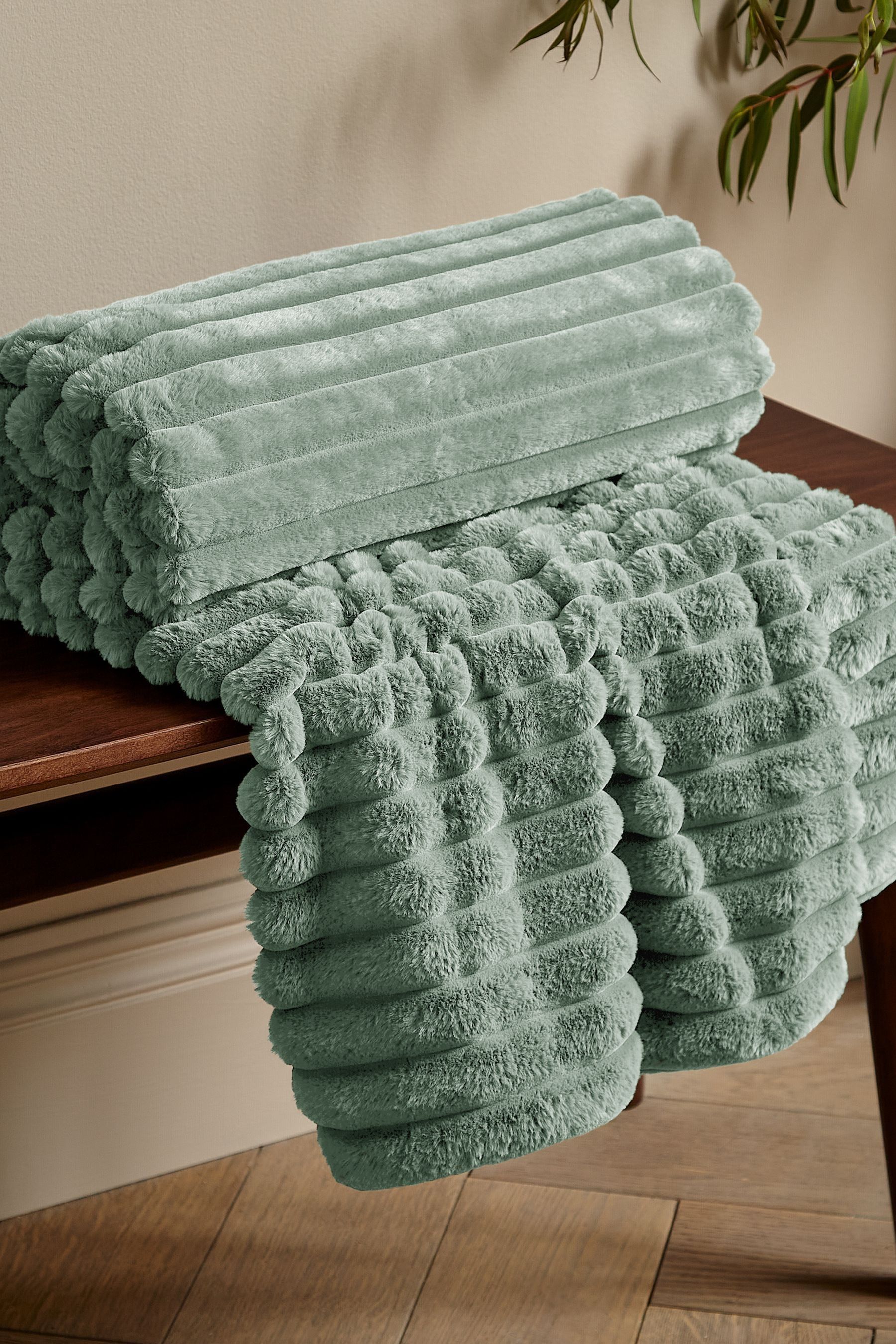 Buy Catherine Lansfield Green Soft and Cosy Ribbed Faux Fur Throw from Next Luxembourg